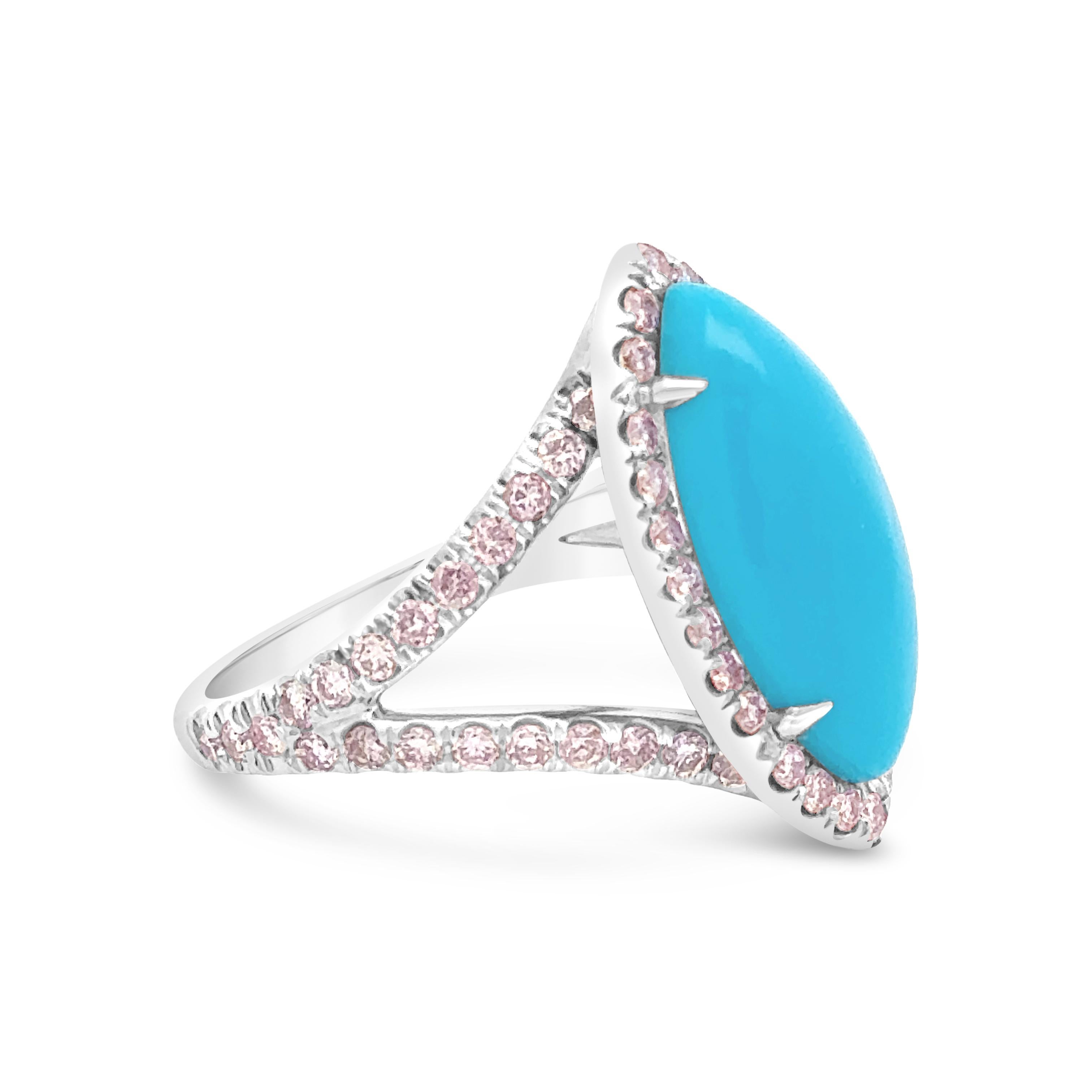 A stylish fashion ring, featuring a 4.91 carats marquise cut natural turquoise surrounded by a halo of round cut natural pink diamonds weighing 1.04 carats total. Finely made with 18K white gold. Size 5.75 US, resizable upon request. 

Roman Malakov