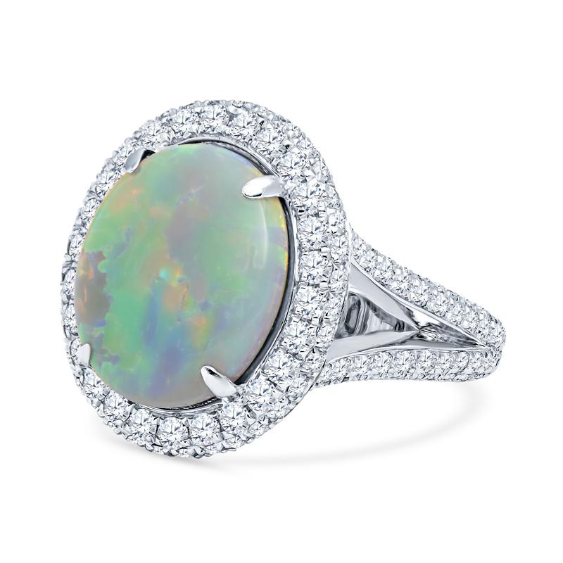 This beautiful Australian Opal and Diamond ring features a spectacular 4.92 carat Lightening Ridge white opal center displaying phenomenal plays of color. The opal flashes stunning hues of orange, yellow, green and blue. It is surrounded by a