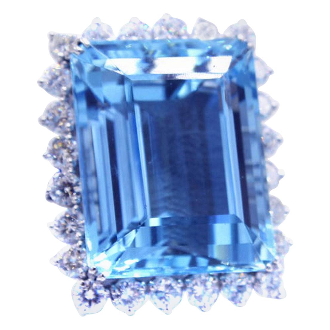 This bold and unique ring showcases a 49.20 carat Santa Maria color step-cut Aquamarine. Aquamarines with such an amazing color saturation and purity are extremely rare and have usually only been found in the famous Santa Maria mines in Brazil. The