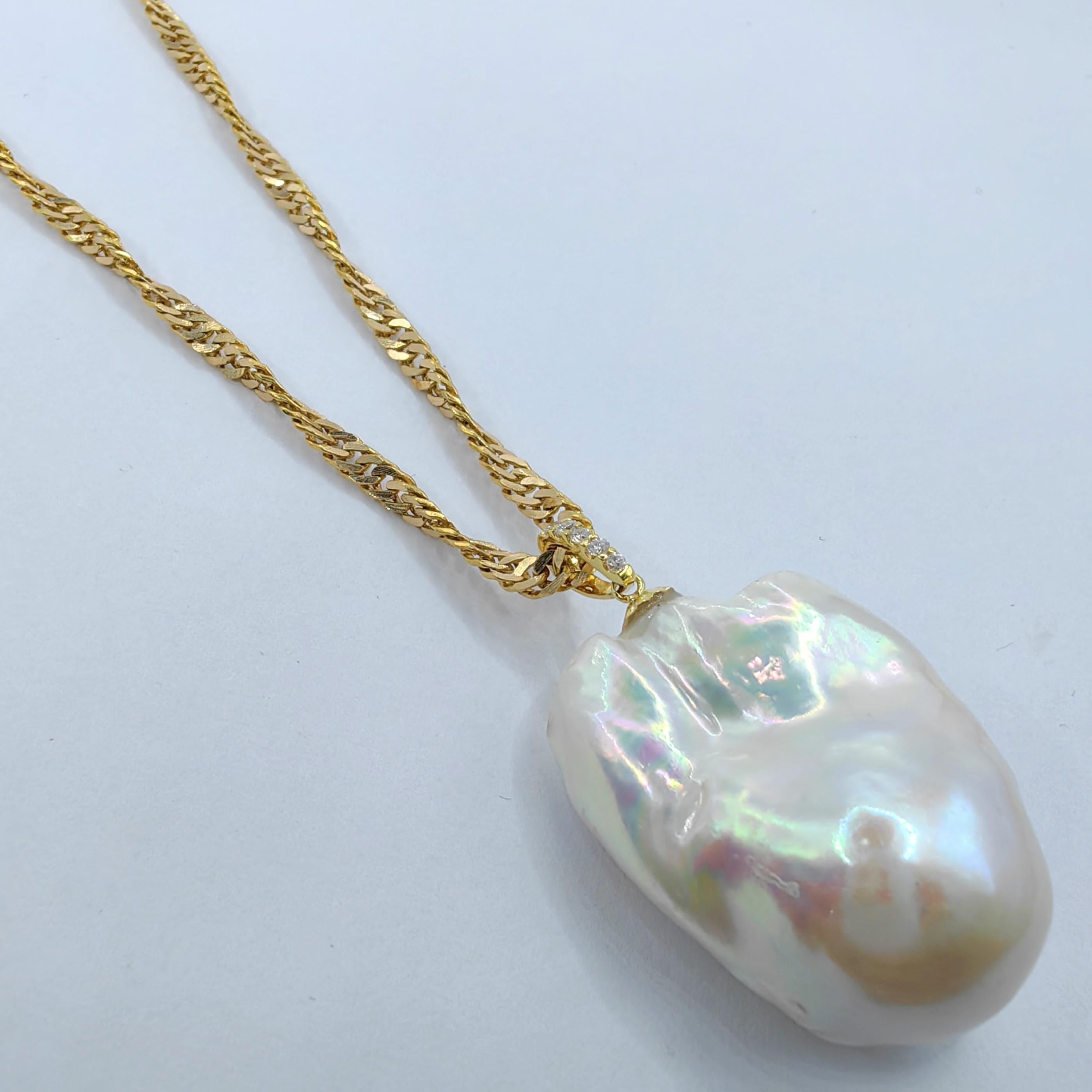 Introducing our mesmerizing 49.24ct Iridescent Baroque Pearl Diamond Pendant, accompanied by a 22K Twisted Chain Necklace in Yellow Gold. This extraordinary pendant features an extra-large Freshwater Baroque Pearl, boasting an impressive weight of