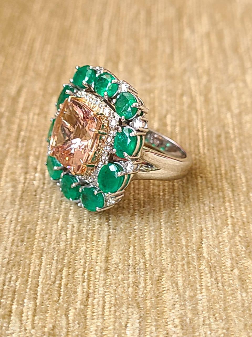 A very beautiful & one of a kind, Morganite and Emerald Cocktail/ Engagement Ring set in 18K Gold & Diamonds. The weight of the square Morganite is 4.93 carats. The weight of the Emeralds is 3.69 carats. The Emeralds are completely natural, without