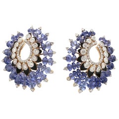 Boucles d'oreilles en or 18 carats avec tanzanite de 49,30 carats et diamants de 3,0 carats