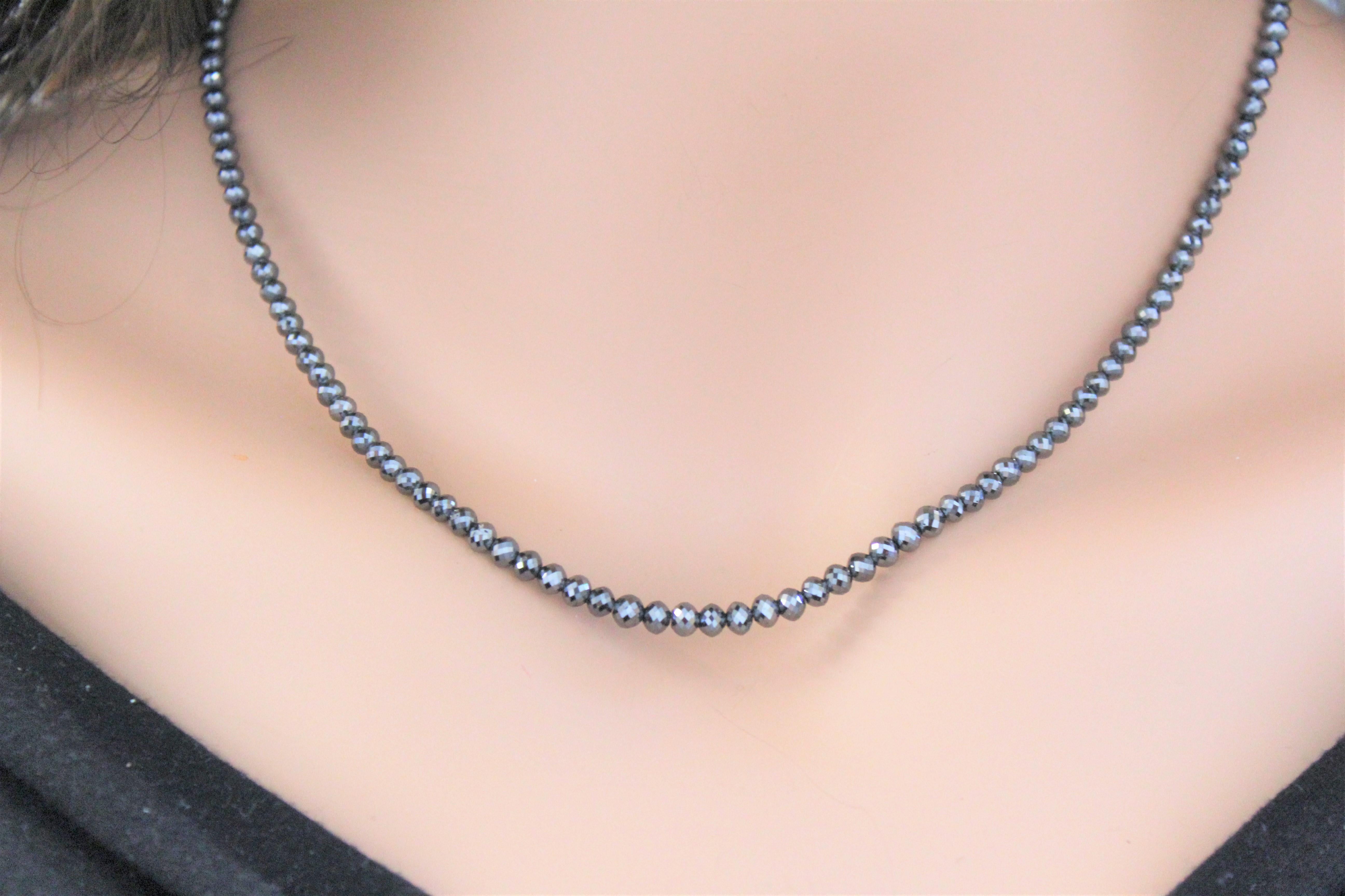 This necklace is a dramatic strand of 146 faceted briolette black diamonds totaling 49.32  carats. Slim in design and perfect for layering alongside other necklaces and chains, this black diamond necklace is sure to get noticed.