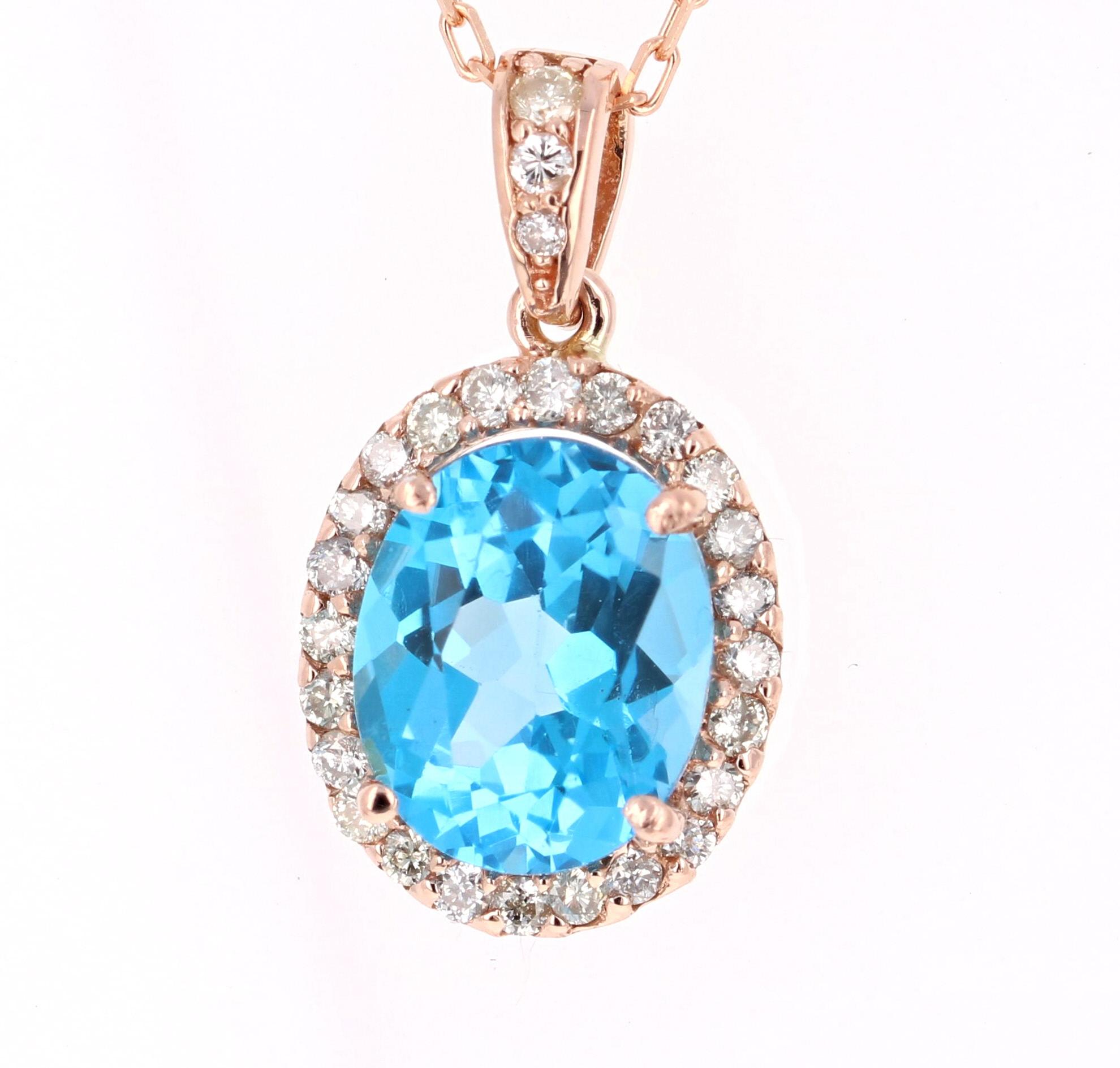 Super cute and classic Pendant made with pretty hues of Blue Topaz and Diamonds.   
4.94 Carat Blue Topaz and Diamond 14 Karat Rose Gold Chain Pendant!

There is an Oval Cut Blue Topaz in the Pendant that weighs 4.49 Carats and is surrounded by 27
