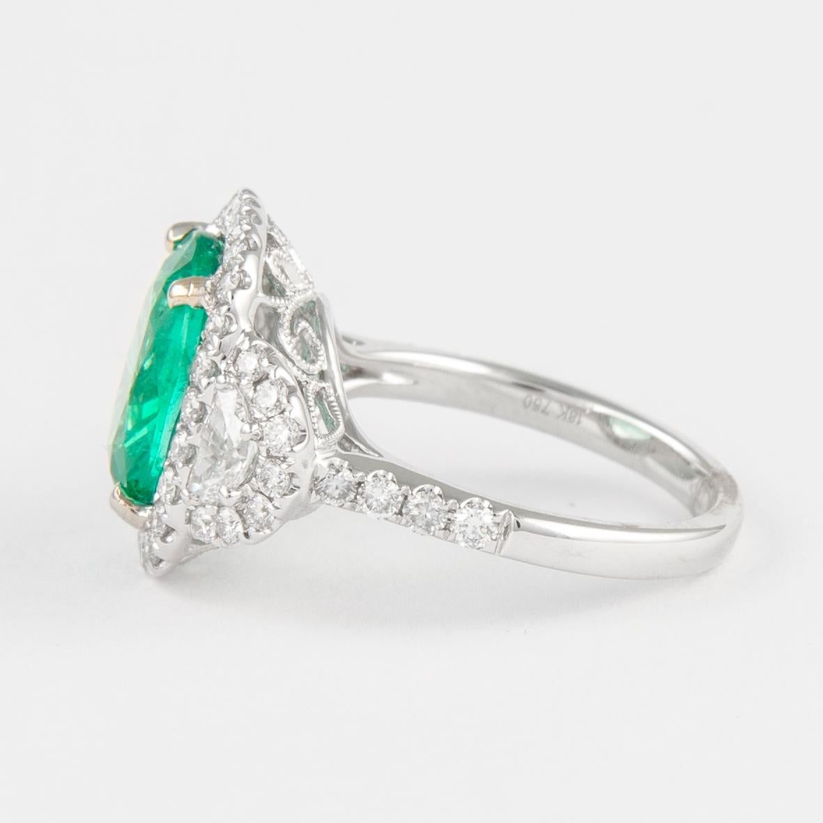 Oval Cut 4.94 Carat Emerald with Diamond Three Stone Halo Ring 18 Karat Gold
