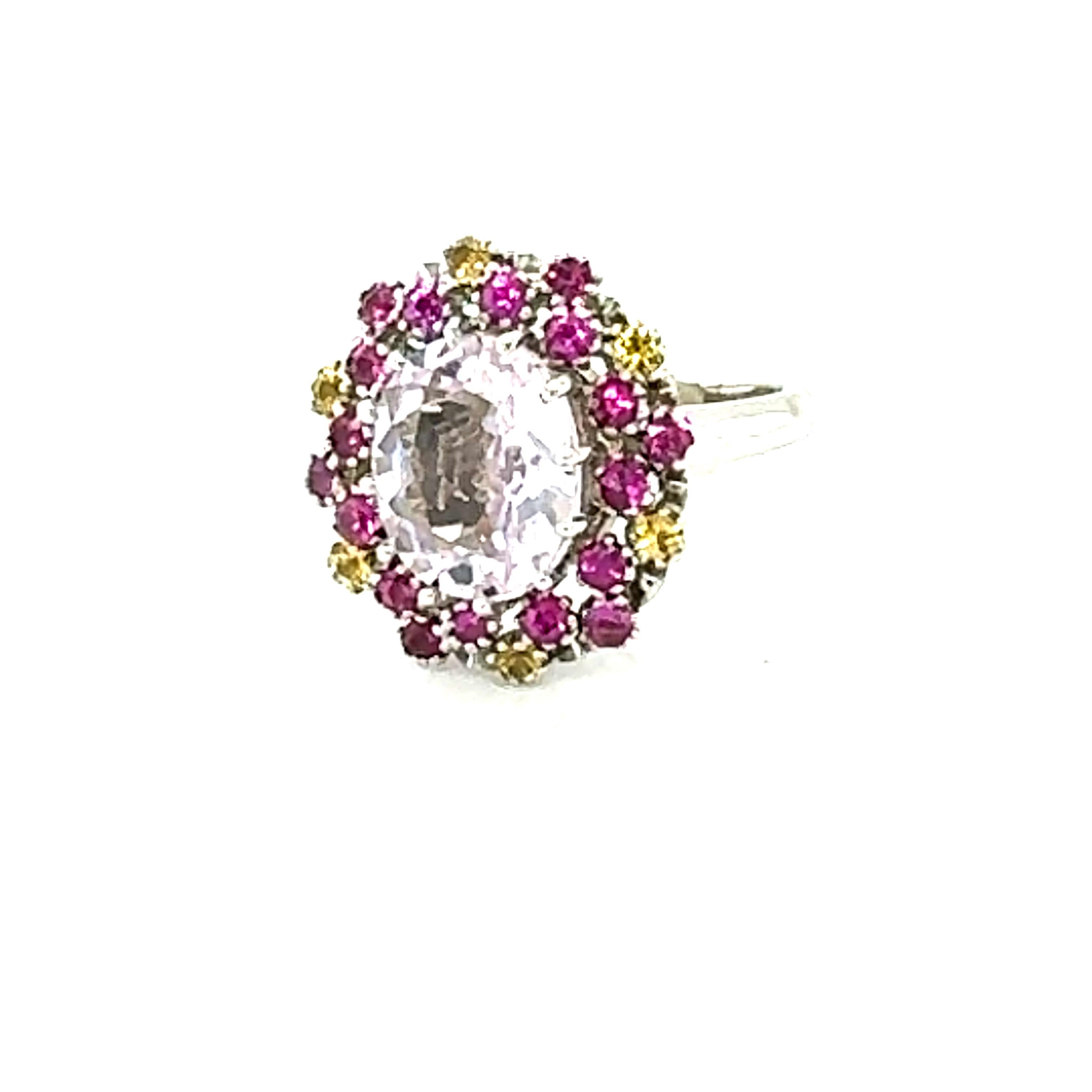 4.94 Carat Kunzite Pink Yellow Sapphire White Gold Cocktail Ring

This beautiful ring has an Oval Cut 3.81 carat Kunzite that is set in the center of the ring and is surrounded by 24 Round Cut Pink and Yellow Sapphires that weigh 1.13 carats. The
