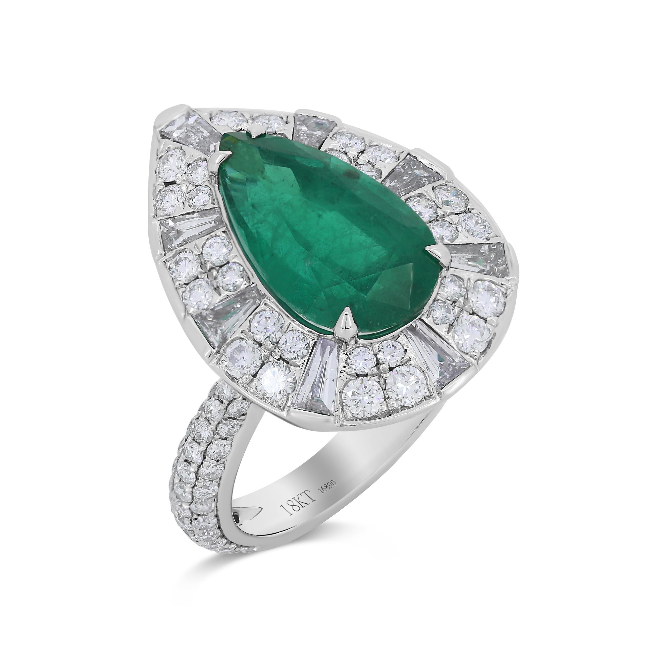 This 18K White Gold pear shape emerald ring is amazingly designed by Nigaam with a variety of white diamonds. On the ring, there are round full cut white diamonds set in micro pave settings. Also, this lovely ring has baguette full cut white
