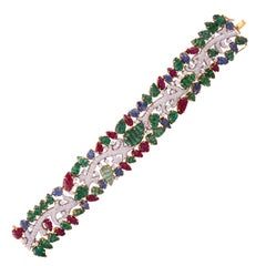 49.46 Carat Emerald Ruby Sapphire Diamond 18 Karat Yellow Gold Cuff Bracelet