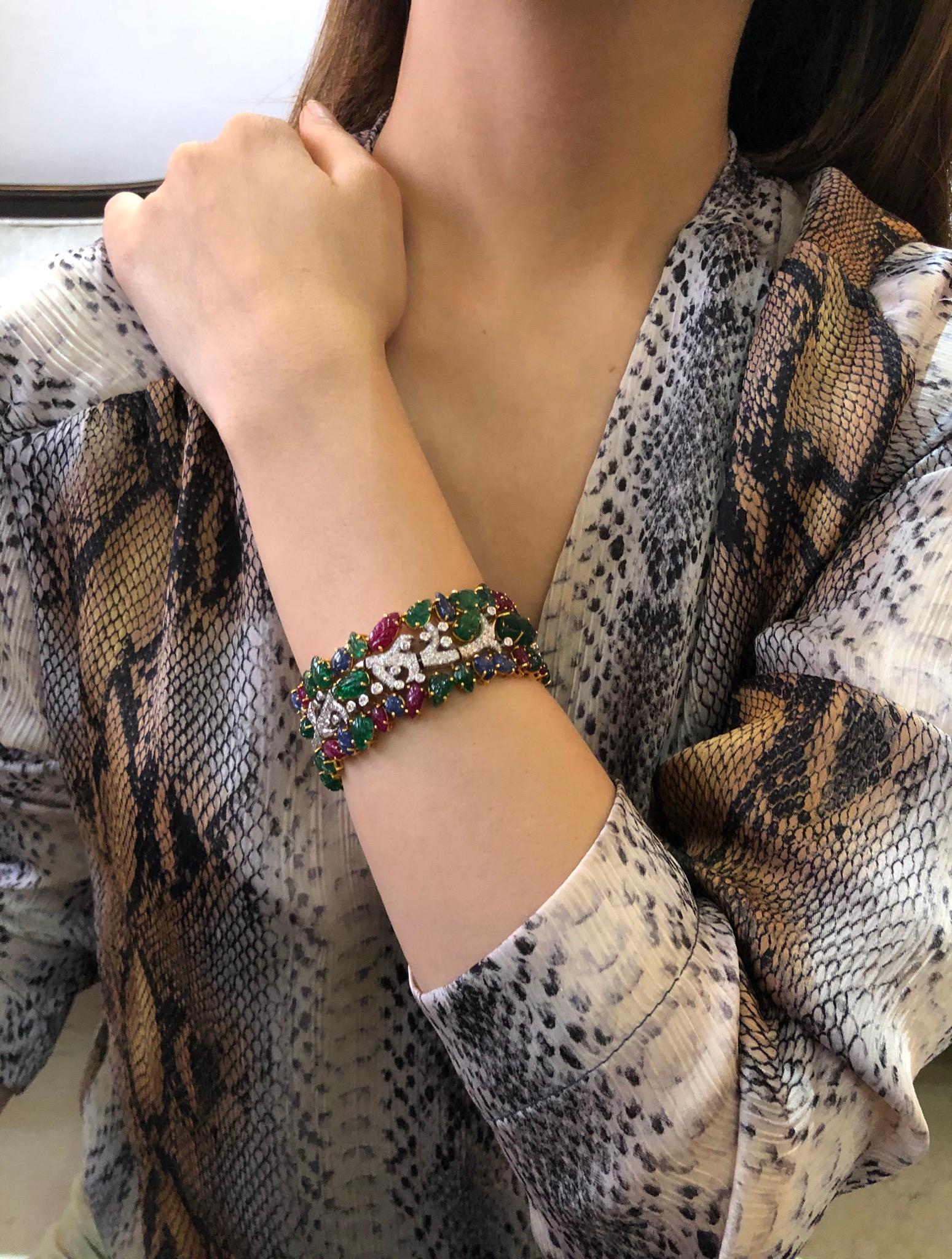 Painstakingly handcrafted by our artisans, this exquisite bracelet cuff features specially cut and carved natural emeralds, rubies and sapphires and diamonds 
Rubies, emeralds, sapphires, diamonds 

Diamonds- 3.49 carats 
Emerald, Ruby, Sapphire-