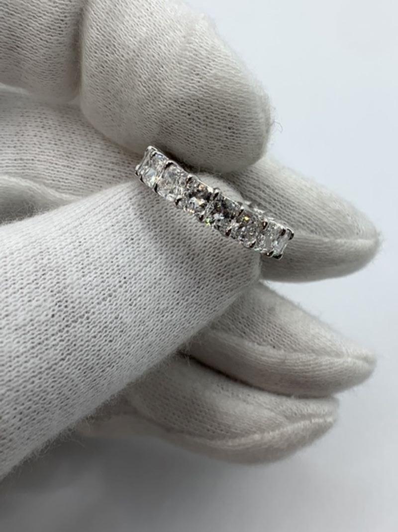 This Beautiful Eternity Band is set with 19 perfectly matched Cushion Cut Diamonds, each weighing over 0.25ct for a total of 4.95 Carats. Each stone is of F-G color and VVS-VS clarity. Made in New York City using Platinum 950. Fits US Size 5.5.

The