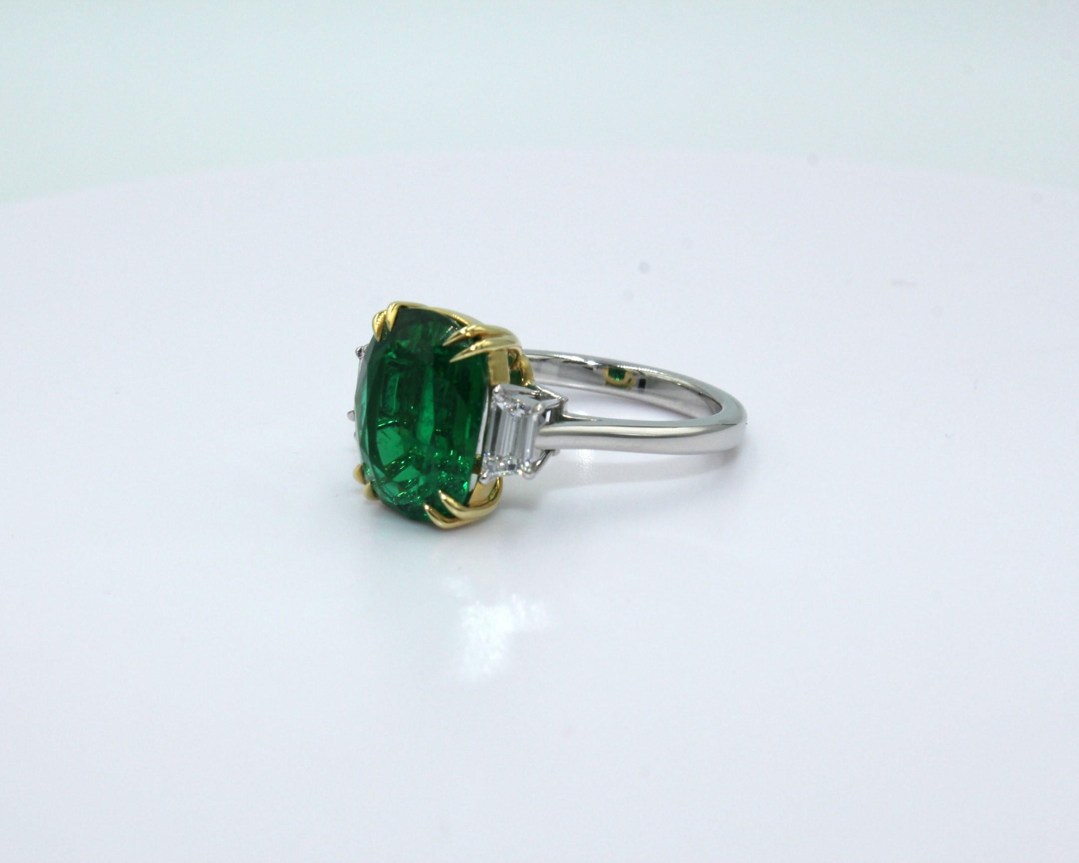 4.95 carats cushion Zambian Emerald with 2 trapezoid shaped diamonds, totaling a diamond weight of 0.39 carat. 

This stunning Emerald Diamond Ring will highlight your elegance and uniqueness. 

Item Details:
- Type: Ring
- Metal: 18K & Platinum
-