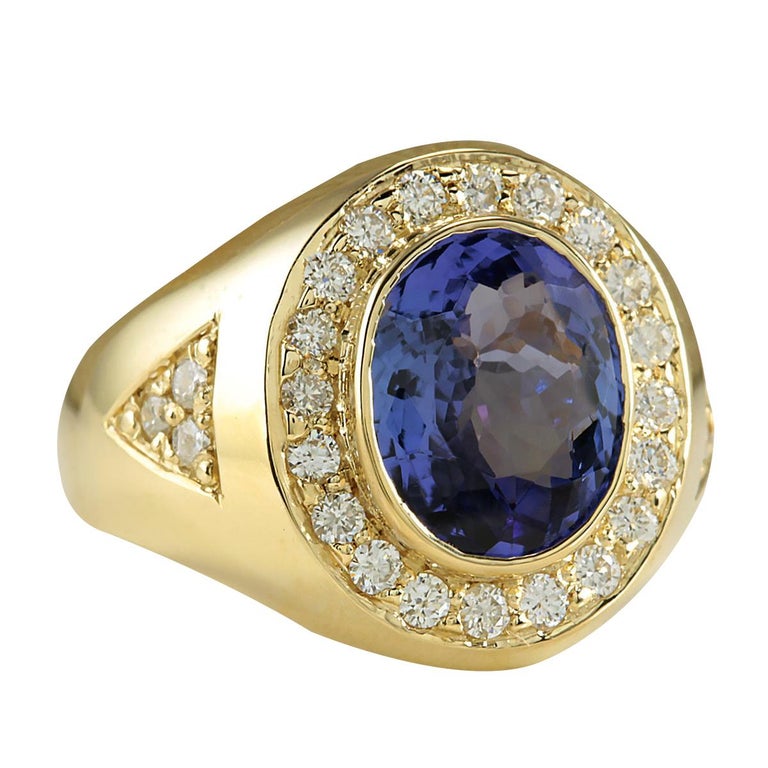 Stamped: 18K Yellow Gold<br>Total Ring Weight: 8.5 Grams<br>Ring Length: N/A<br>Ring Width: N/A<br>Gemstone Weight: Total Natural Tanzanite Weight is 4.25 Carat (Measures: 12.10x9.80 mm)<br>Color: Blue<br>Diamond Weight: Total Natural Diamond Weight