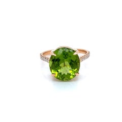 4.95 Carat Oval Peridot and Diamond Ring in 9 Karat Yellow Gold