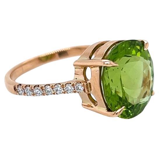 4.95 Carat Oval Peridot and Diamond Ring in 9 Karat Yellow Gold For Sale
