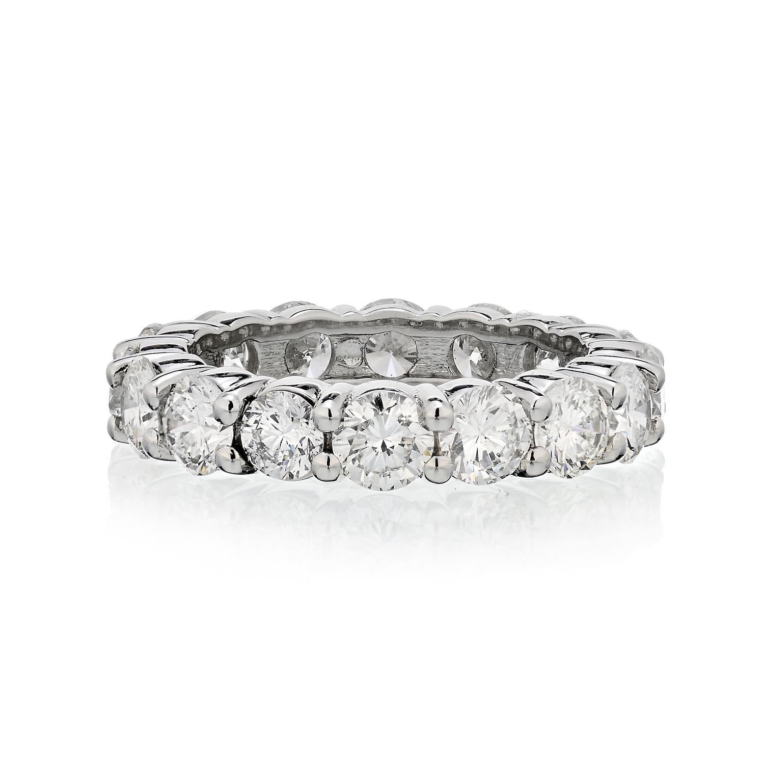 A stunning celebration of your commitment, this round-cut diamond eternity band is a confident choice for your bride or bride-to-be. Expertly crafted in sleek platinum, this sensational style showcases sparkling diamonds - each boasting a color rank