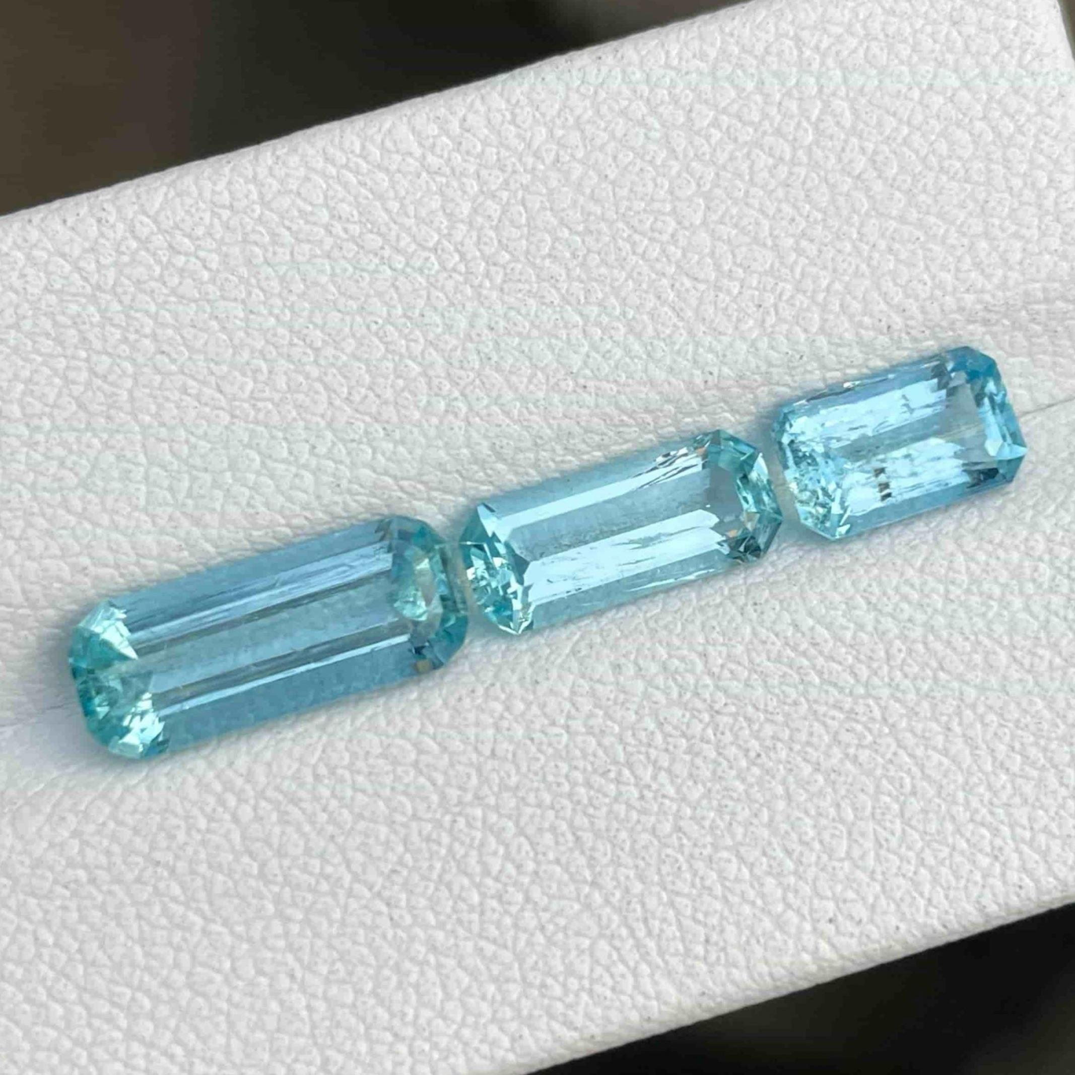 Gemstone Type Natural Intense Blue Aquamarine
Weight 4.95 carats
Individual Weight 2.10, 1.15, and 1.10 carats
Clarity Slightly Included (SI)
Origin Brazil
Treatment None





Indulge in the allure of nature's beauty with this extraordinary batch of
