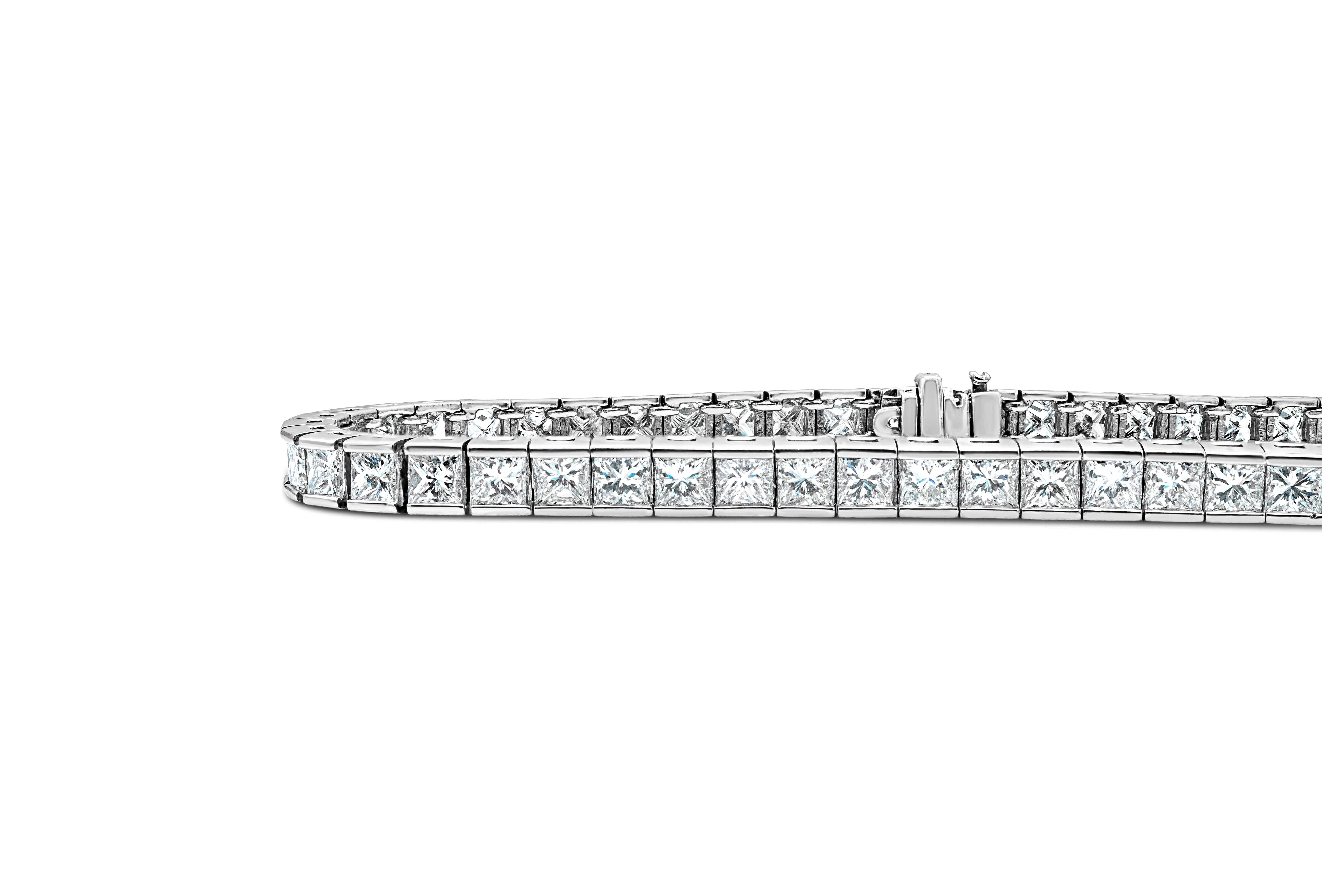 Classic tennis bracelet showcasing 56 brilliant round diamonds weighing 4.95 carats total, G-H color and SI2-I1 in clarity. Designed with two diamonds in each channel set link and made in 14K white gold. Perfect for your everyday use. 

