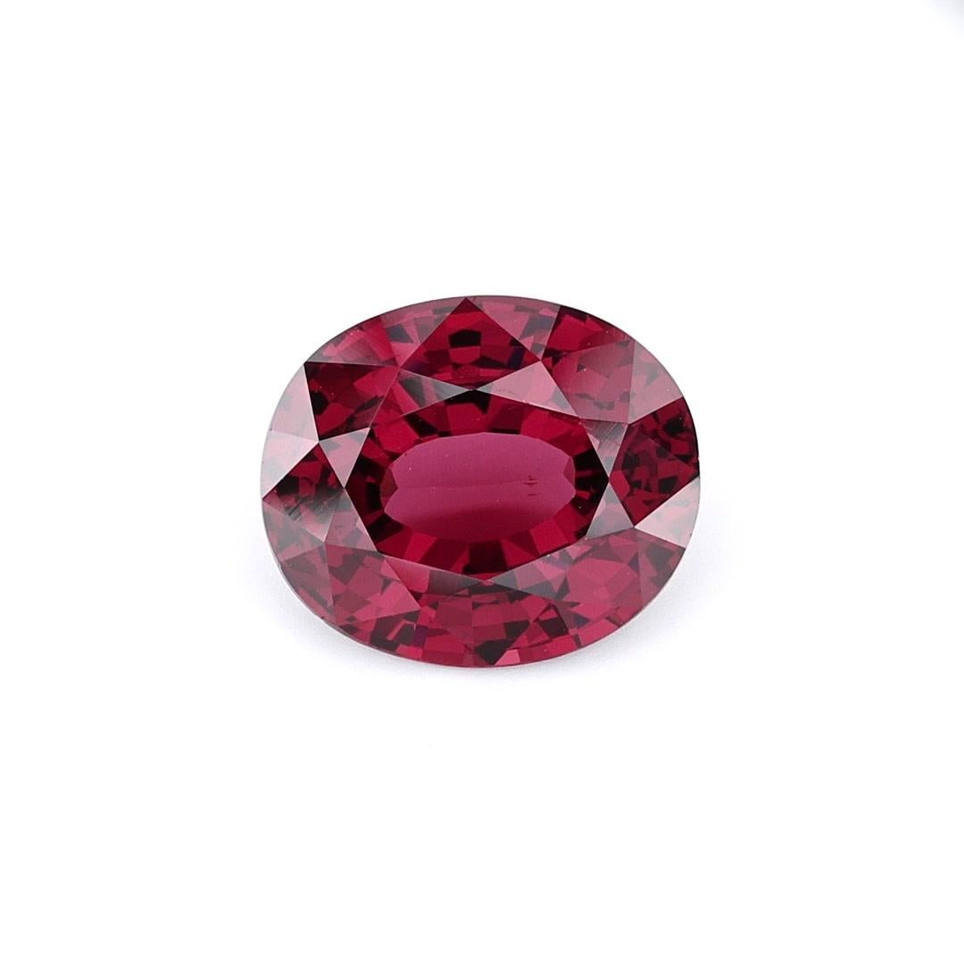 This Internally Flawless Ceylon Natural Rhodolite Garnet showcases a captivating Pigeon Blood Red hue, making it a truly remarkable gemstone. With its Oveal shape and a weight of 4.95 carats, this gem exudes elegance and sophistication. Its flawless