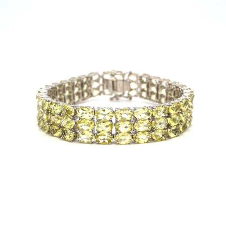 49.50 CT Lemon Topaz Gemstone Wide Women Bracelet in sterling silver showcases endlessly sparkling natural lemon topaz, weighing 49.50 carat. It measures 7 inches long in length. 
Lemon Topaz stimulate concentration and reduces stress. 
Designed