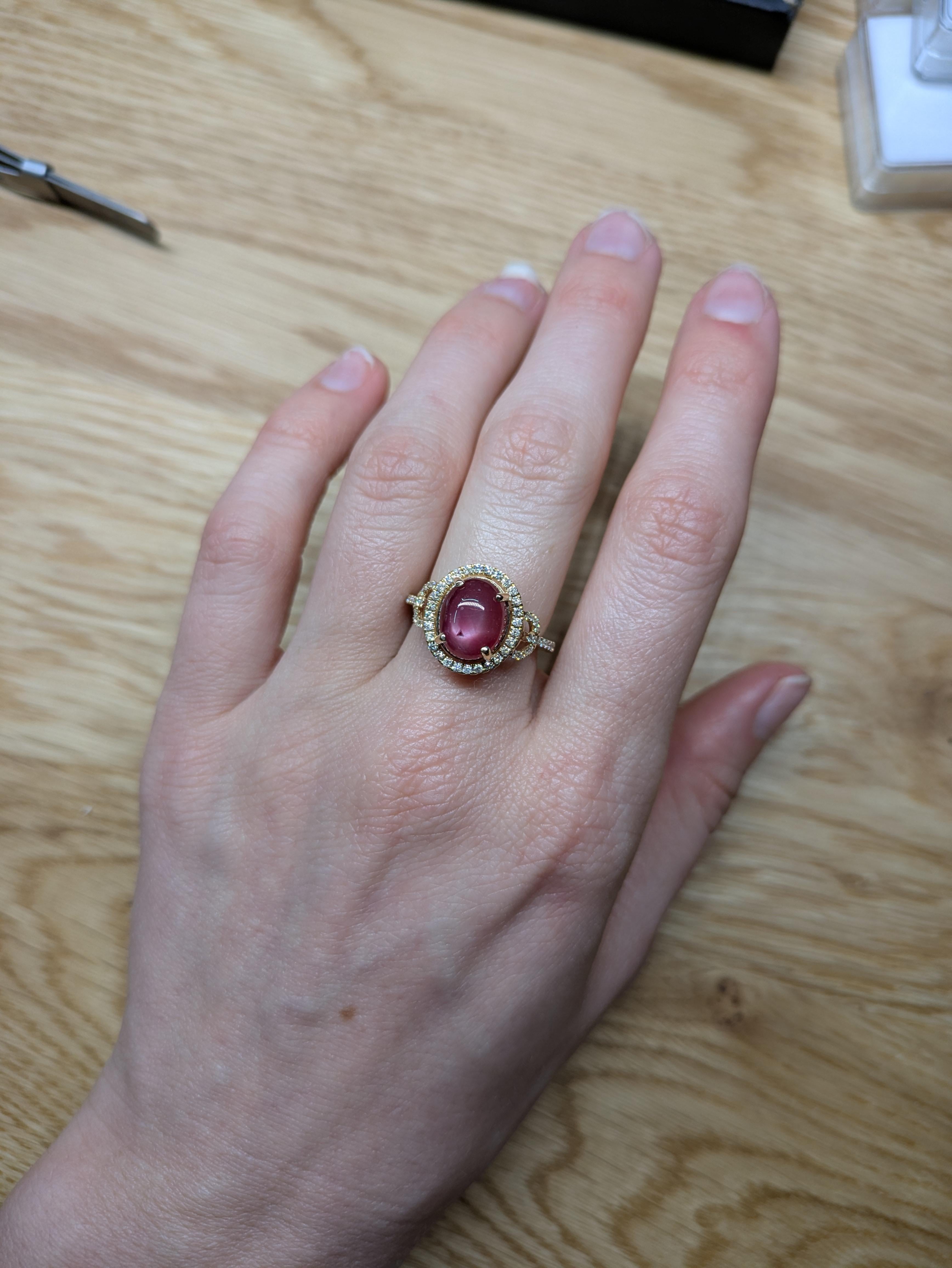 This exquisite ring features a 5-carat natural star ruby with a stunning star-like shine. It's surrounded by sparkling real diamonds and set in solid 14K gold, making it a timeless and elegant piece. Perfect for anyone who loves unique and classy