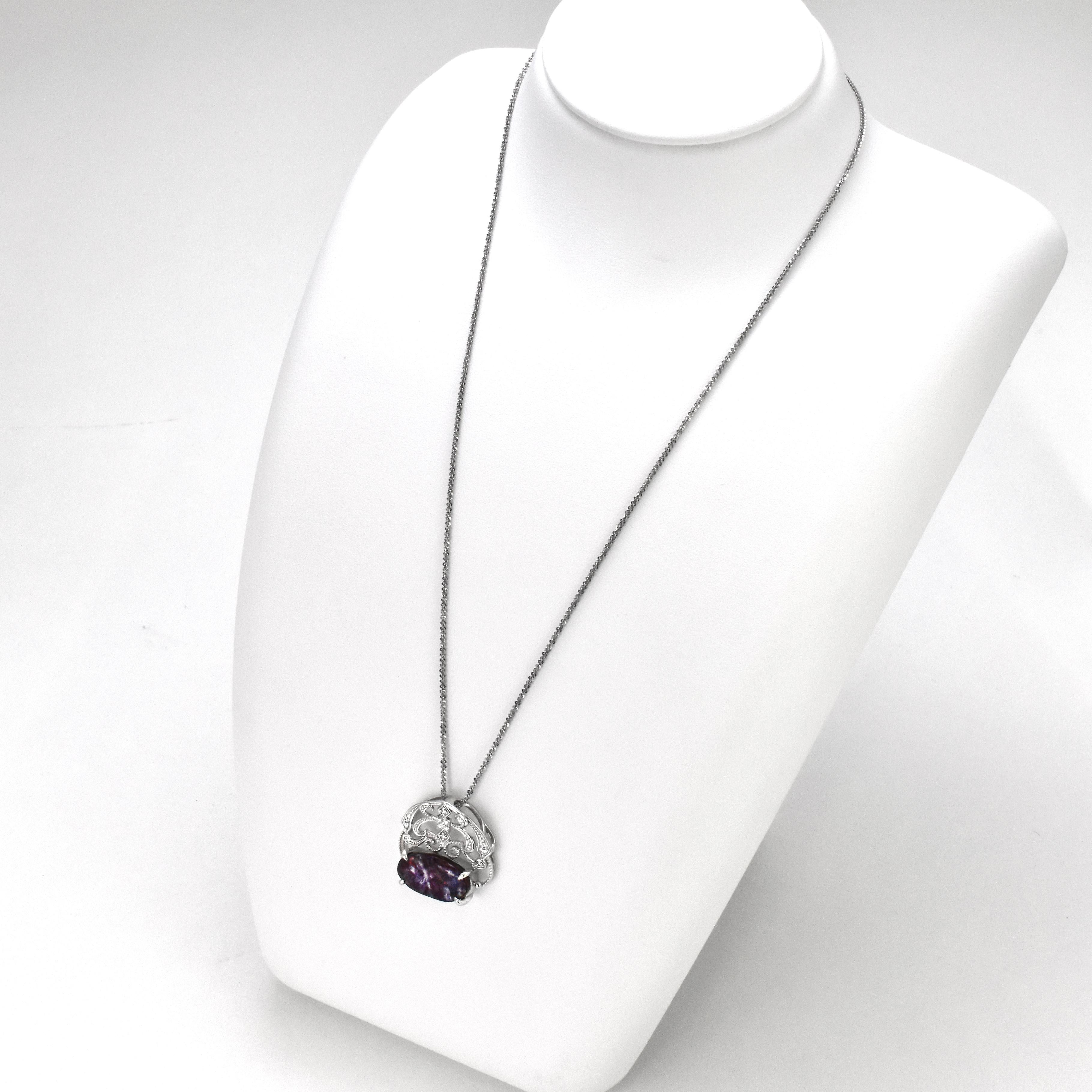 A beautiful pendant featuring a 4.96 Carat, Natural, Australian Boulder Opal and 0.12 Carats of Diamond Accents set in Platinum. The Opal displays very good play of color! Opals are known for exhibiting flashes of rainbow colors known as 