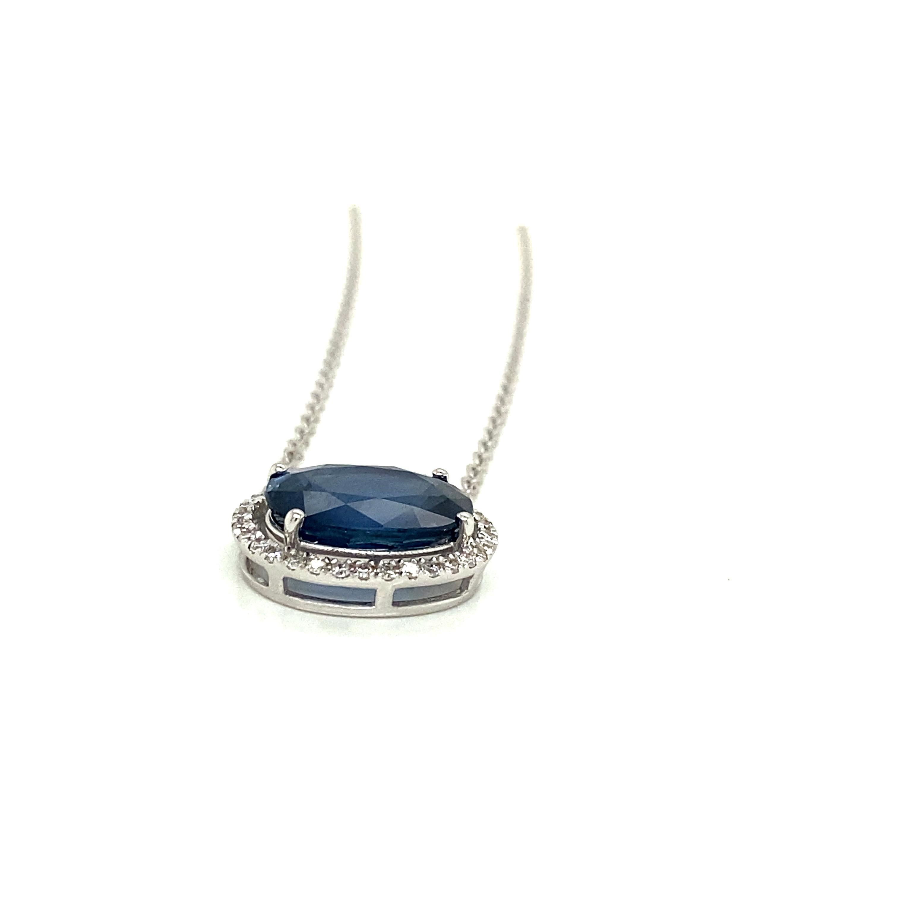 4.96 Carat Oval-Cut Vivid Blue Sapphire and White Diamond Pendant Necklace:

A beautiful pendant necklace, it features a 4.96 carat oval-cut vivid blue sapphire in the centre surrounded by a halo of white round-brilliant cut diamonds weighing 0.19
