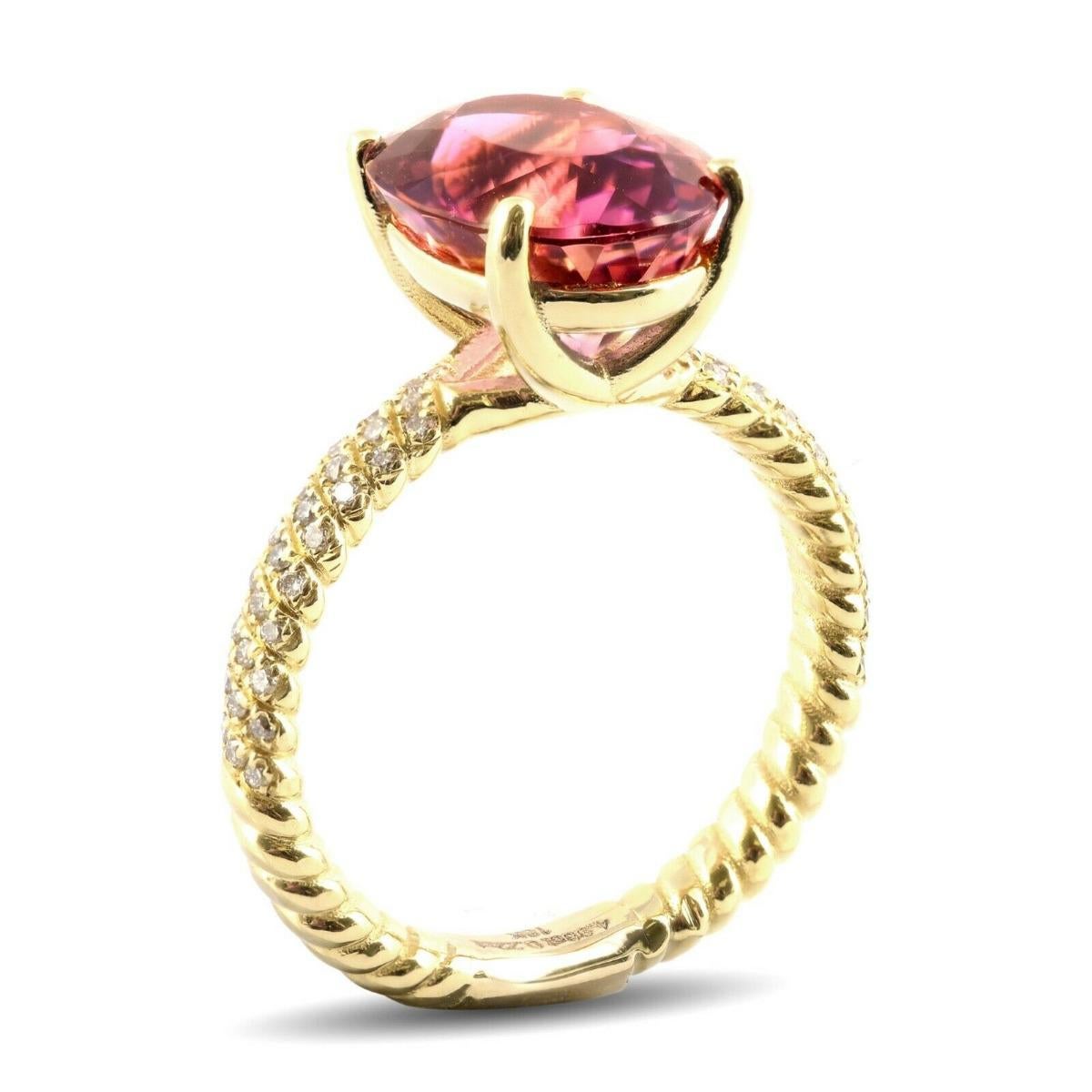 With a 4.96 carats intense Pink Tourmaline at the center of this ring, you will surely make a statement. Set with a halo of diamonds this 18K yellow gold ring has a natural flow, which is both feminine and classy.

Ring Overview
SKU
3416
Center