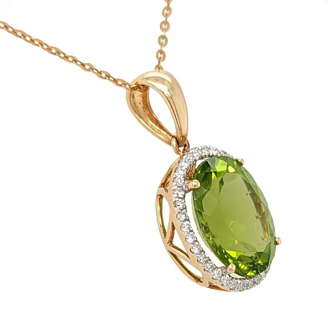 This 4.96ct peridot and diamond pendant in 18k yellow gold exudes timeless elegance and unmatched luxury. Crafted from natural peridot and natural diamonds in 18kt yellow gold, it is finished with an exquisite 18