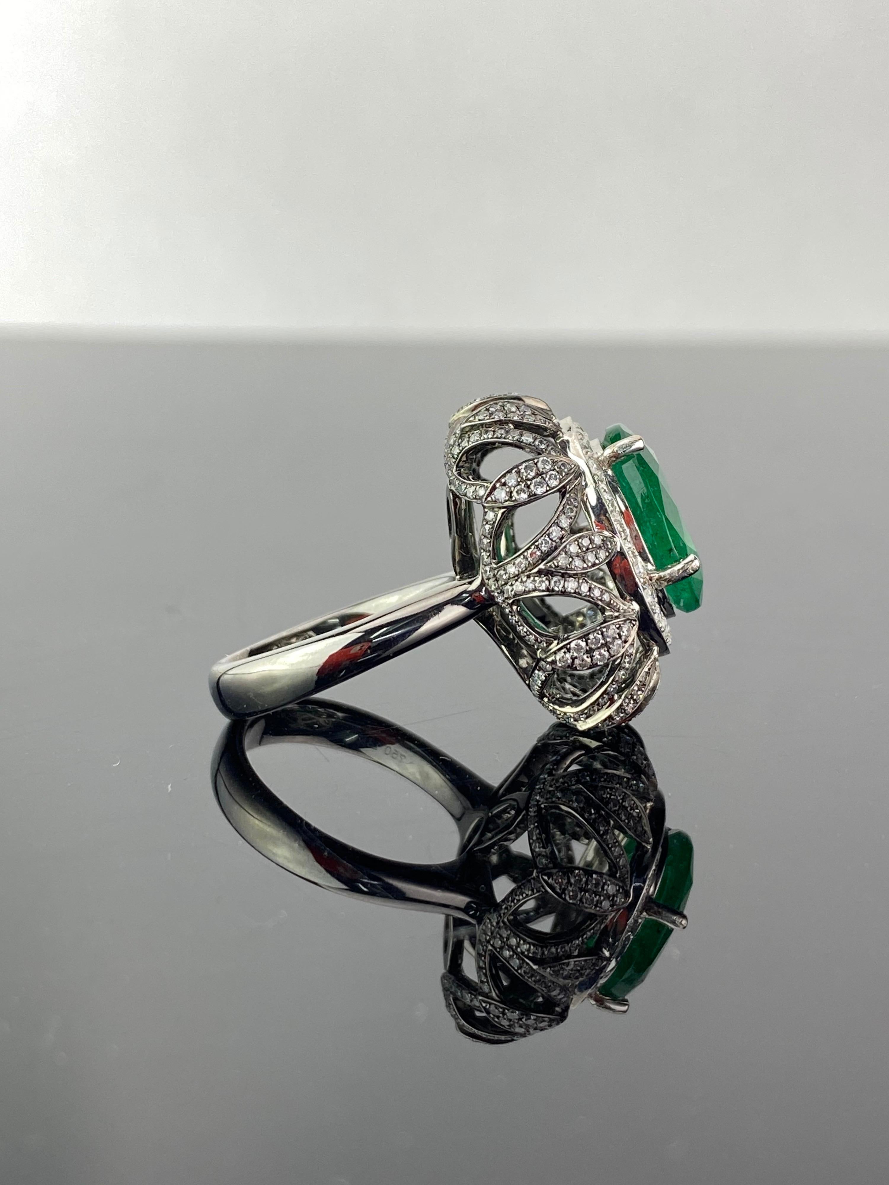A statement 4.97 carat Zambian Emerald and Diamond dome cocktail ring, with 1.8 carat White Diamonds - set in solid 18K Gold (white and black rhodium plated). The ring is currently sized at US 7, and is resizable. 
We are jewelry manufacturers,