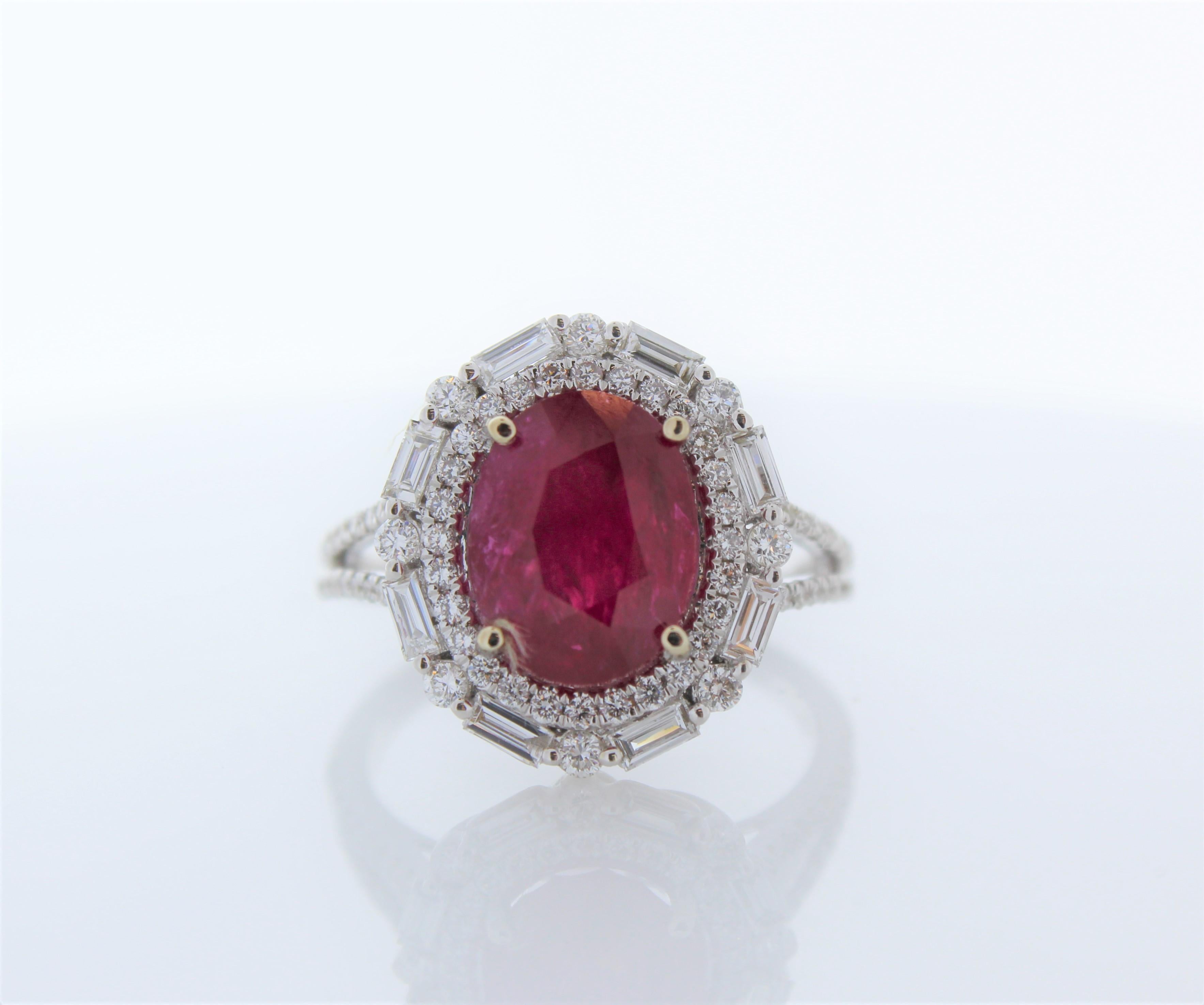 This is a cocktail ring featuring a 4.97 red ruby. The gem source is Myanmar. Its color is blood red with no modifier colors. Its transparency and luster are superb. The vibrant red is complemented by a dazzling display of marquise cut diamonds,