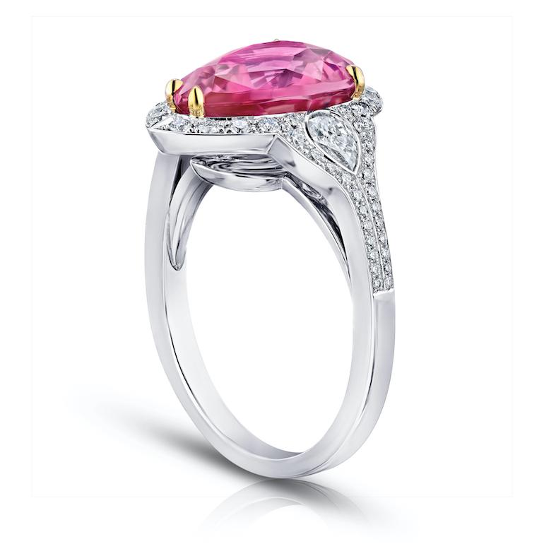 4.97 carat pear shape (natural no heat) pink sapphire with pear shape and brilliant round diamonds .62 carats set in a platinum and 18k yellow gold ring.
