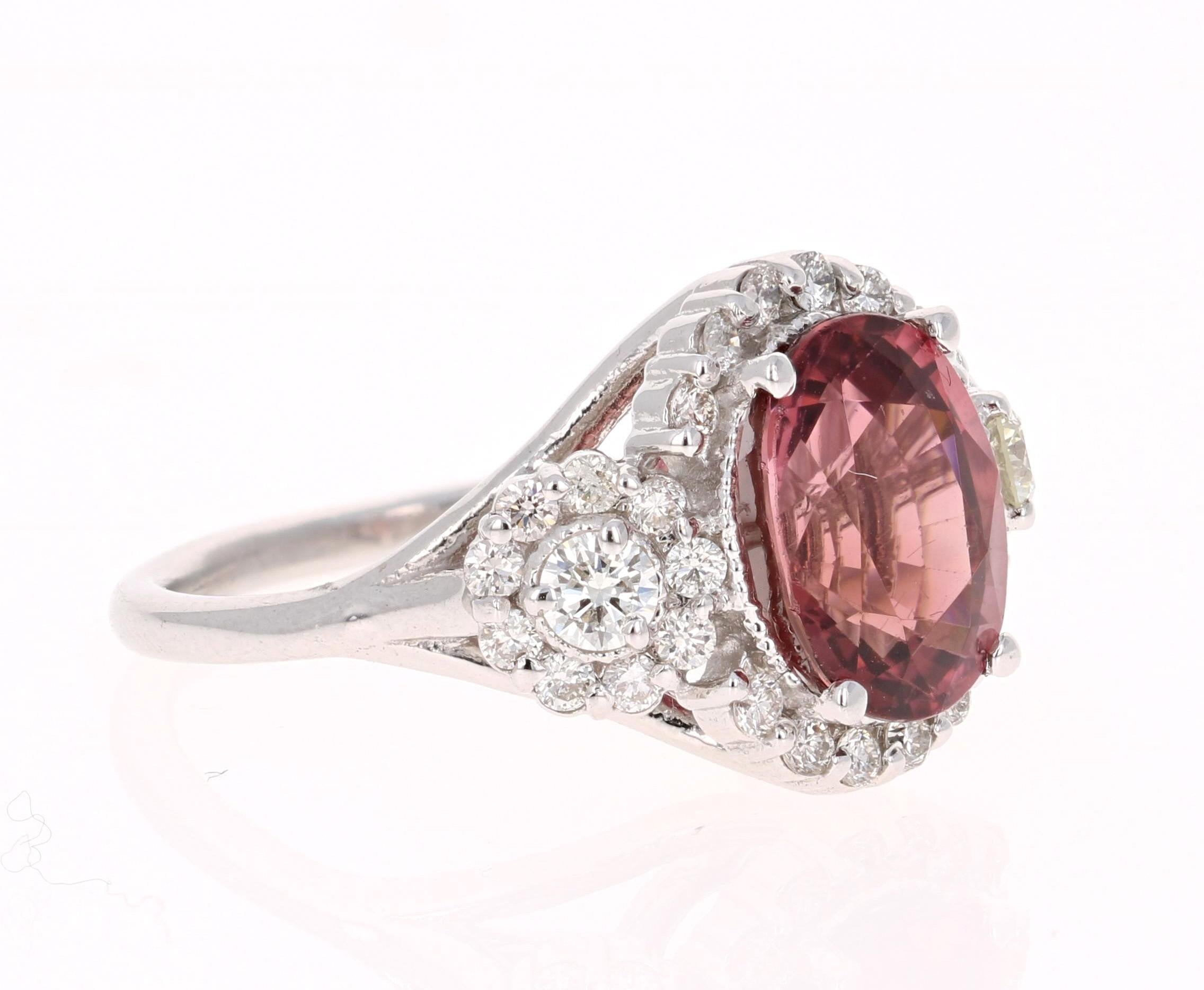 This ring has a gorgeous Oval Cut Pink Tourmaline that weighs 4.15 Carats. Floating around the tourmaline are 2 Round Cut Diamonds that weigh 0.26 Carats (VS-H) and 30 Round Cut Diamonds that weigh 0.56 Carats (VS-H)
The total carat weight of the
