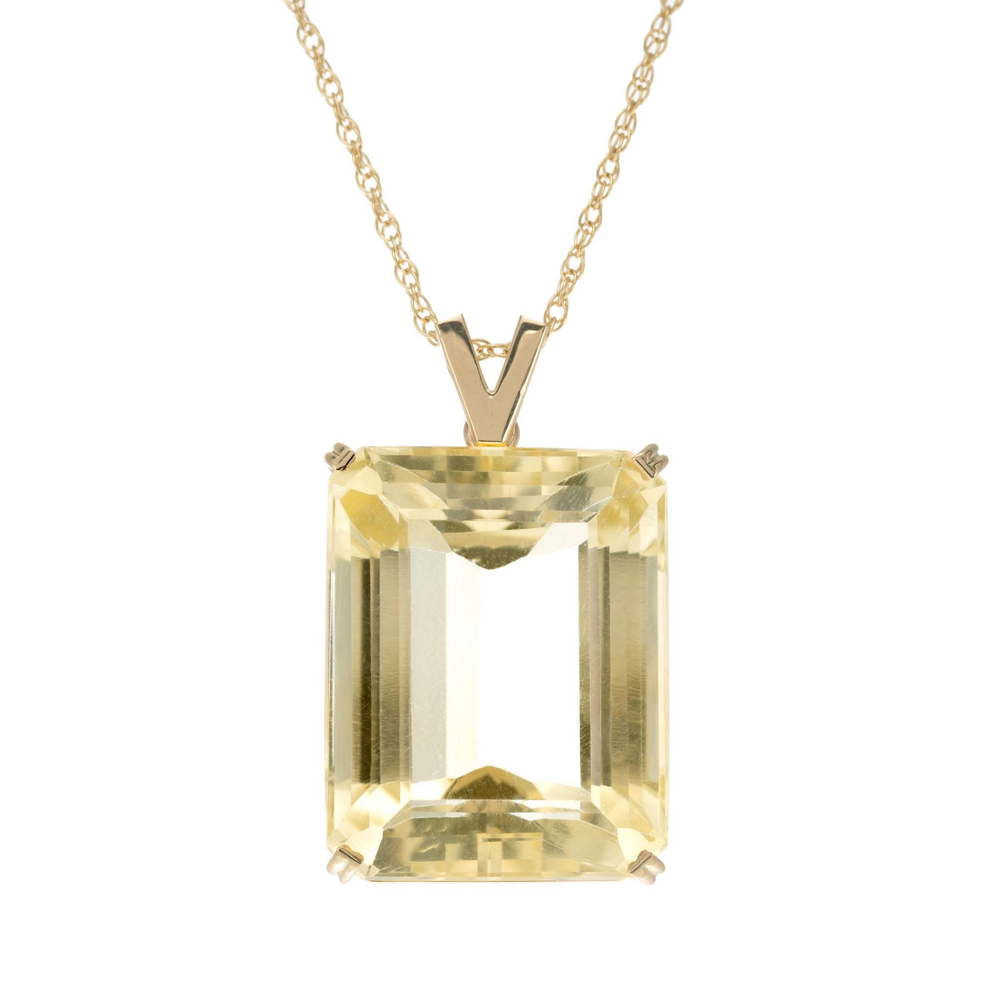 Soft yellow 49.79 carat emerald cut citrine in 14k yellow gold pendant on a 20 Inch chain. 

1 emerald cut brownish yellow citrine, approx. 49.79cts
14k yellow gold 
Stamped: 14k
15.0 grams
Top to bottom: 33.5mm or 1 1/3 Inch
Width: 20mm or ¾