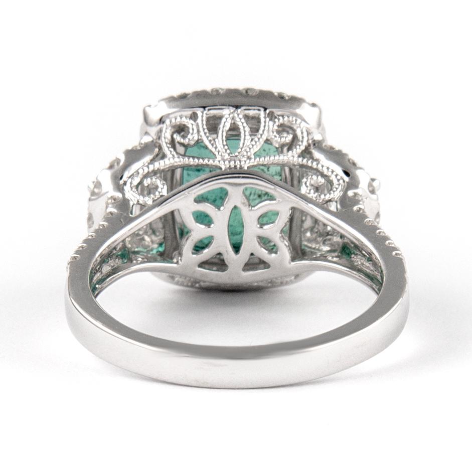 4.97ctt Emerald with Diamond Three Stone Halo Ring 18 Karat Gold In New Condition In BEVERLY HILLS, CA