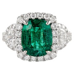 4.97ctt Emerald with Diamond Three Stone Halo Ring 18 Karat Gold