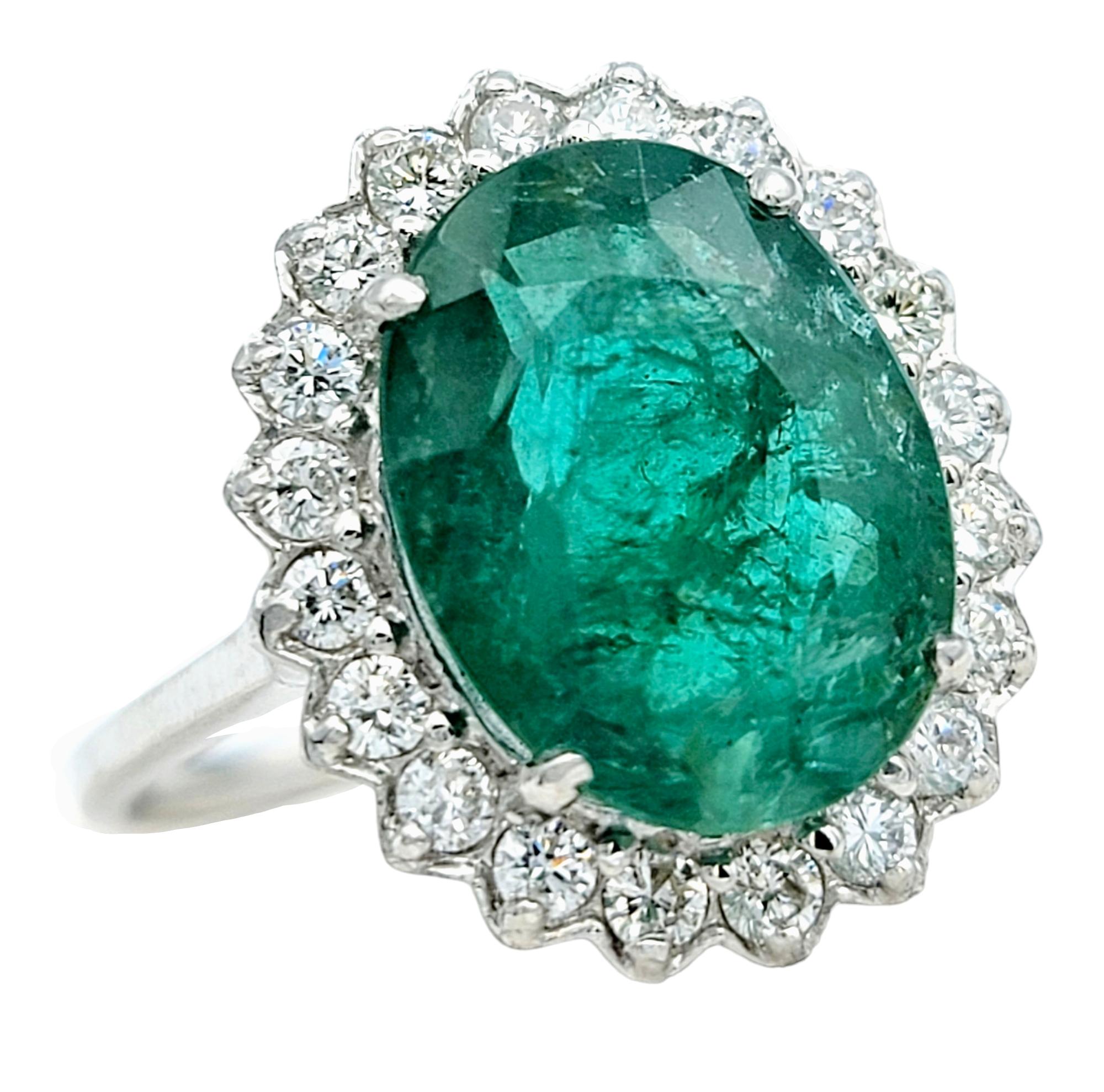 Contemporary 4.98 Carat Oval Cut Emerald and Diamond Halo Ring Set in 18 Karat White Gold For Sale