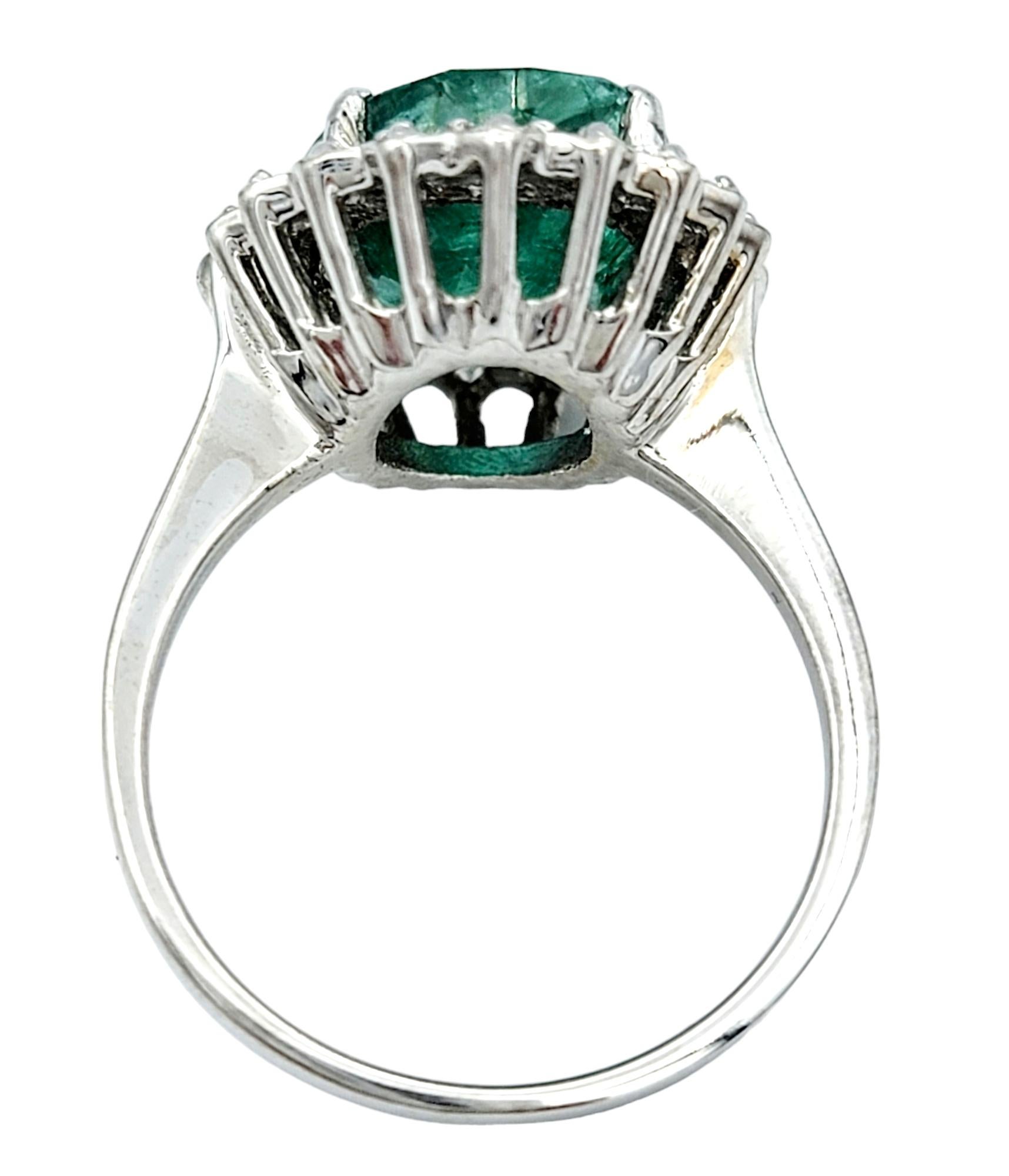 Women's 4.98 Carat Oval Cut Emerald and Diamond Halo Ring Set in 18 Karat White Gold For Sale
