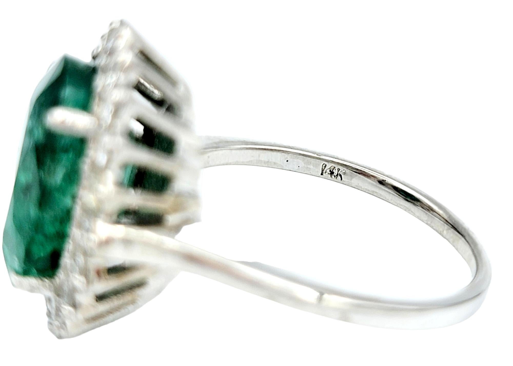 4.98 Carat Oval Cut Emerald and Diamond Halo Ring Set in 18 Karat White Gold For Sale 2