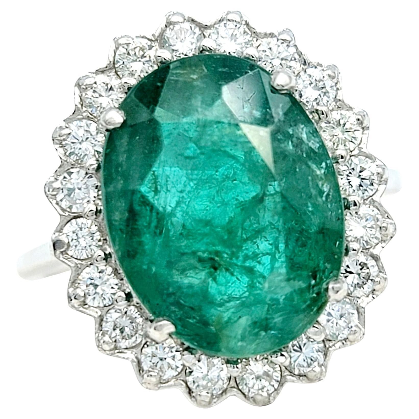 4.98 Carat Oval Cut Emerald and Diamond Halo Ring Set in 18 Karat White Gold For Sale