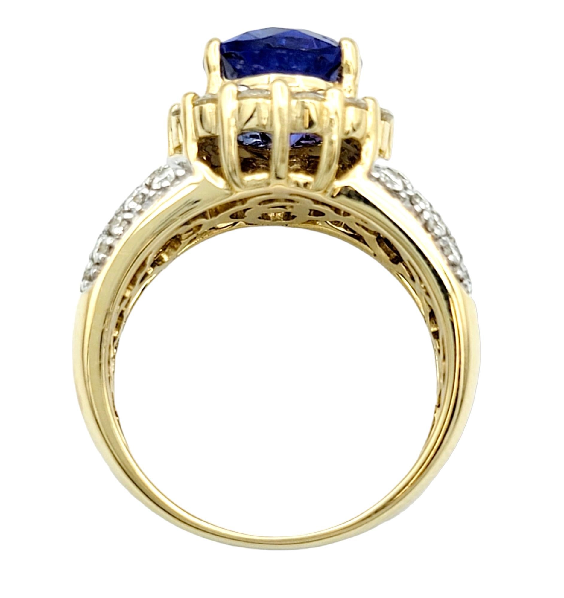 Women's 4.98 Carat Total Oval Tanzanite and Diamond Halo Cocktail Ring in 14 Karat Gold For Sale