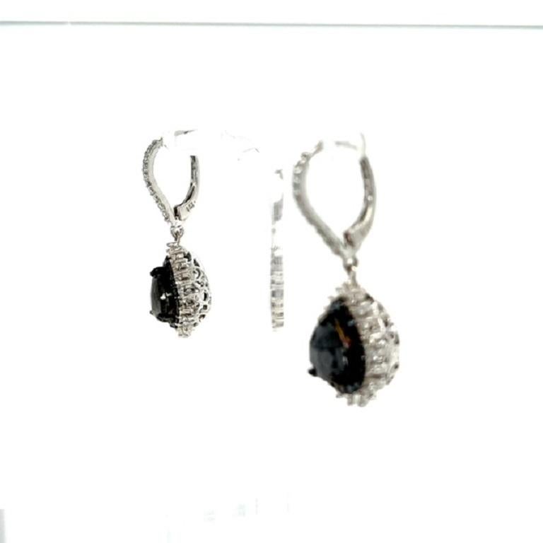 The most stunning black diamond earrings! Classy and Chic!

These beauties have Natural Pear Cut Black Diamonds that weigh 2.87 Carats and Natural Round Cut Diamonds that weigh 1.42 Carats, Clarity: SI, Color: F. Also they are adorned with natural