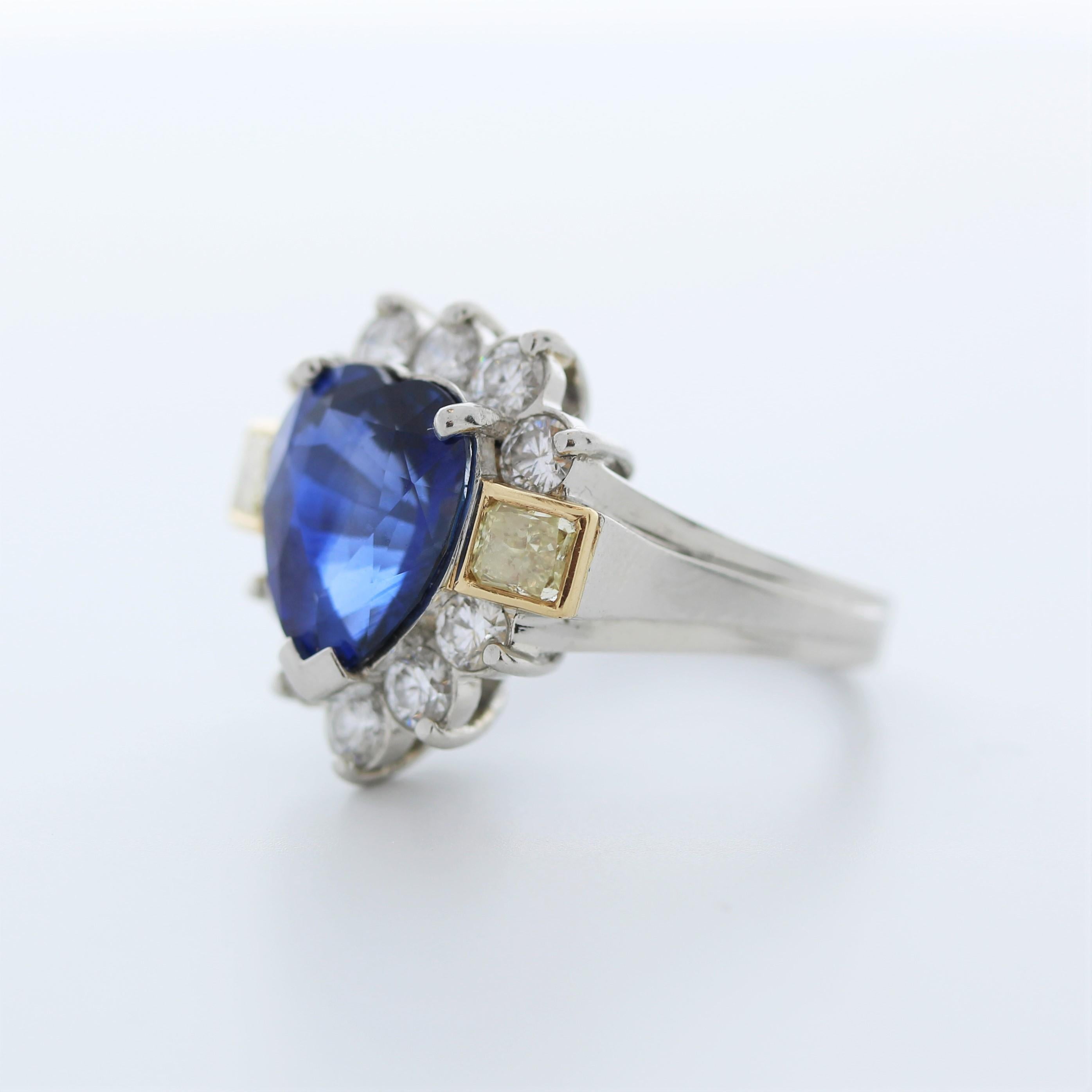 A fashion ring featuring a combination of platinum and 18k gold with a main stone of a certified 4.99 carat heart-shaped blue sapphire, accompanied by 12 round-cut diamonds totaling 1.5 carats as side stones, would be an exquisite and high-quality