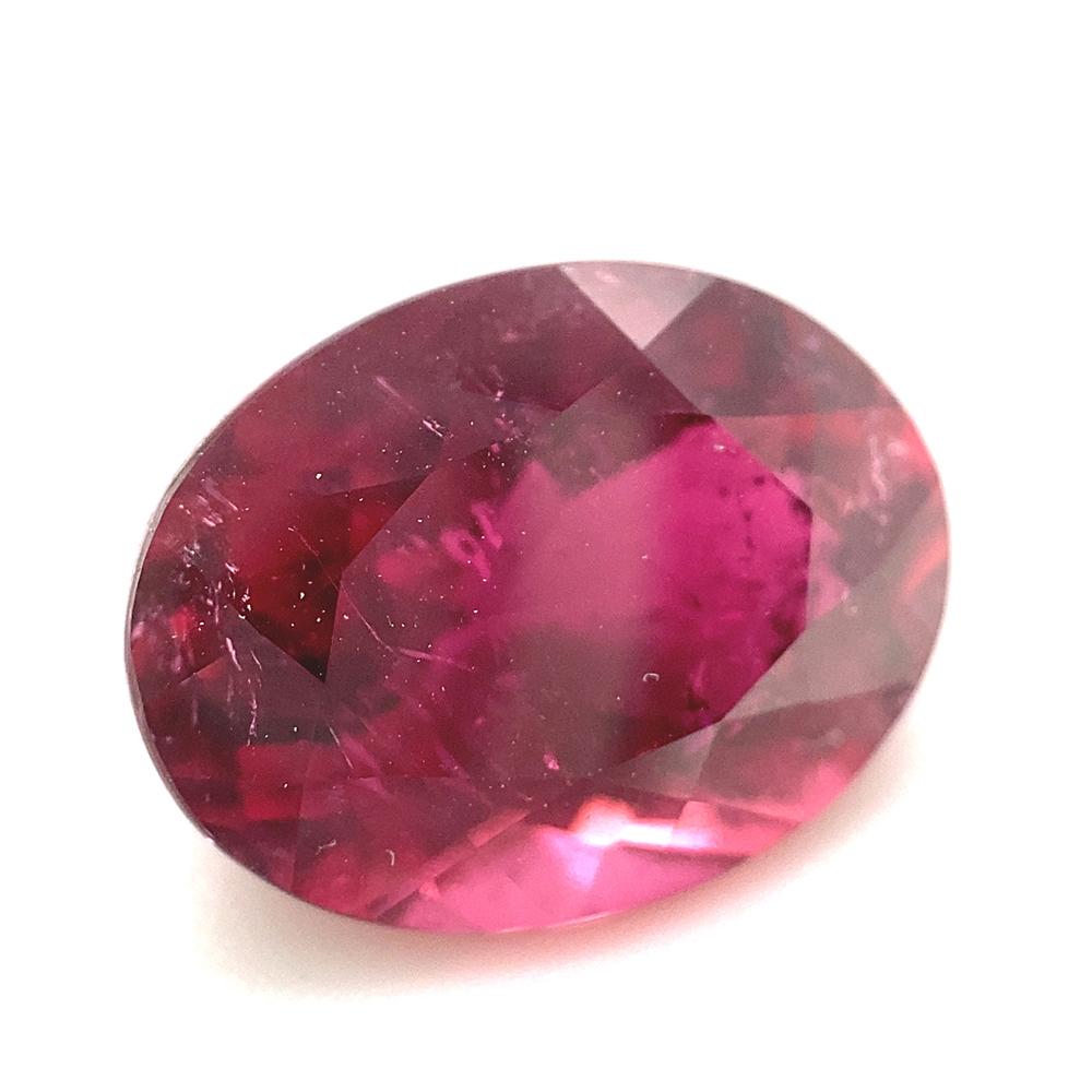 Description:

Gem Type: Tourmaline 
Number of Stones: 1
Weight: 4.9 cts 
Measurements: 12.25 x 9.37 x 6.48 mm
Shape: Oval
Cutting Style Crown: Brilliant Cut
Cutting Style Pavilion: Modified Brilliant Cut 
Transparency: Transparent
Clarity: Slightly