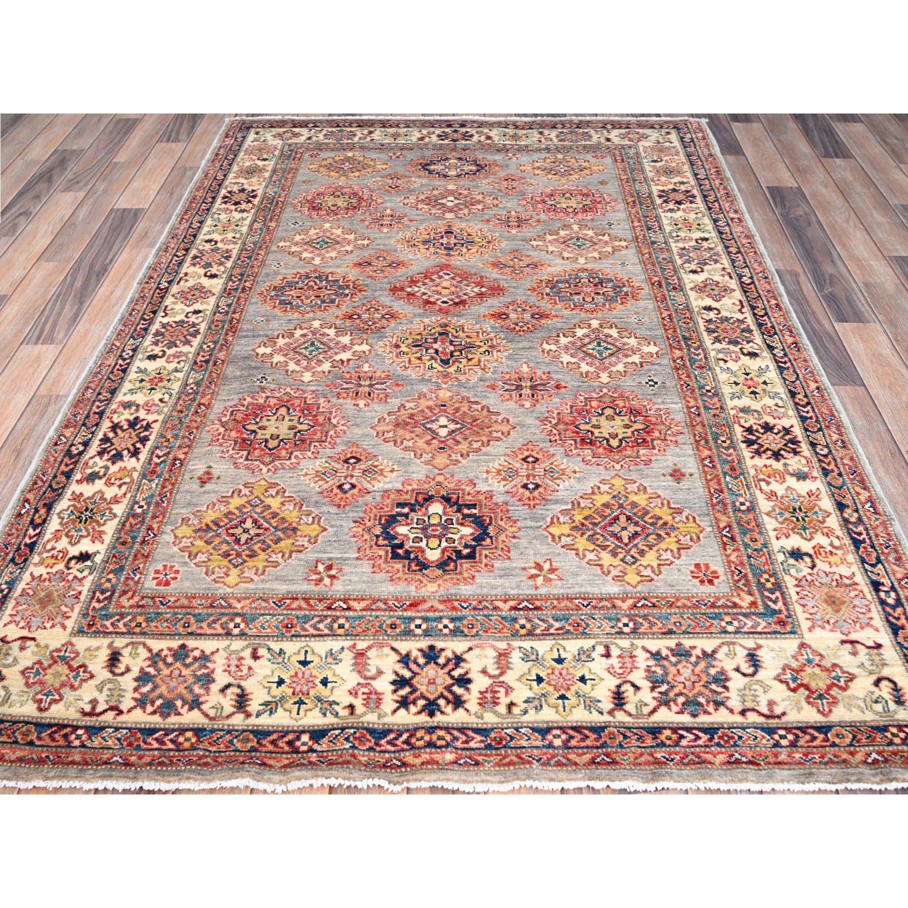 This is a truly genuine one-of-a-kind Afghan Super Kazak, Hand Knotted, Pure Wool, Oriental Rug. It has been Knotted for months and months in the centuries-old weaving craftsmanship techniques by expert artisans.
Primary materials: Wool
Latex: No