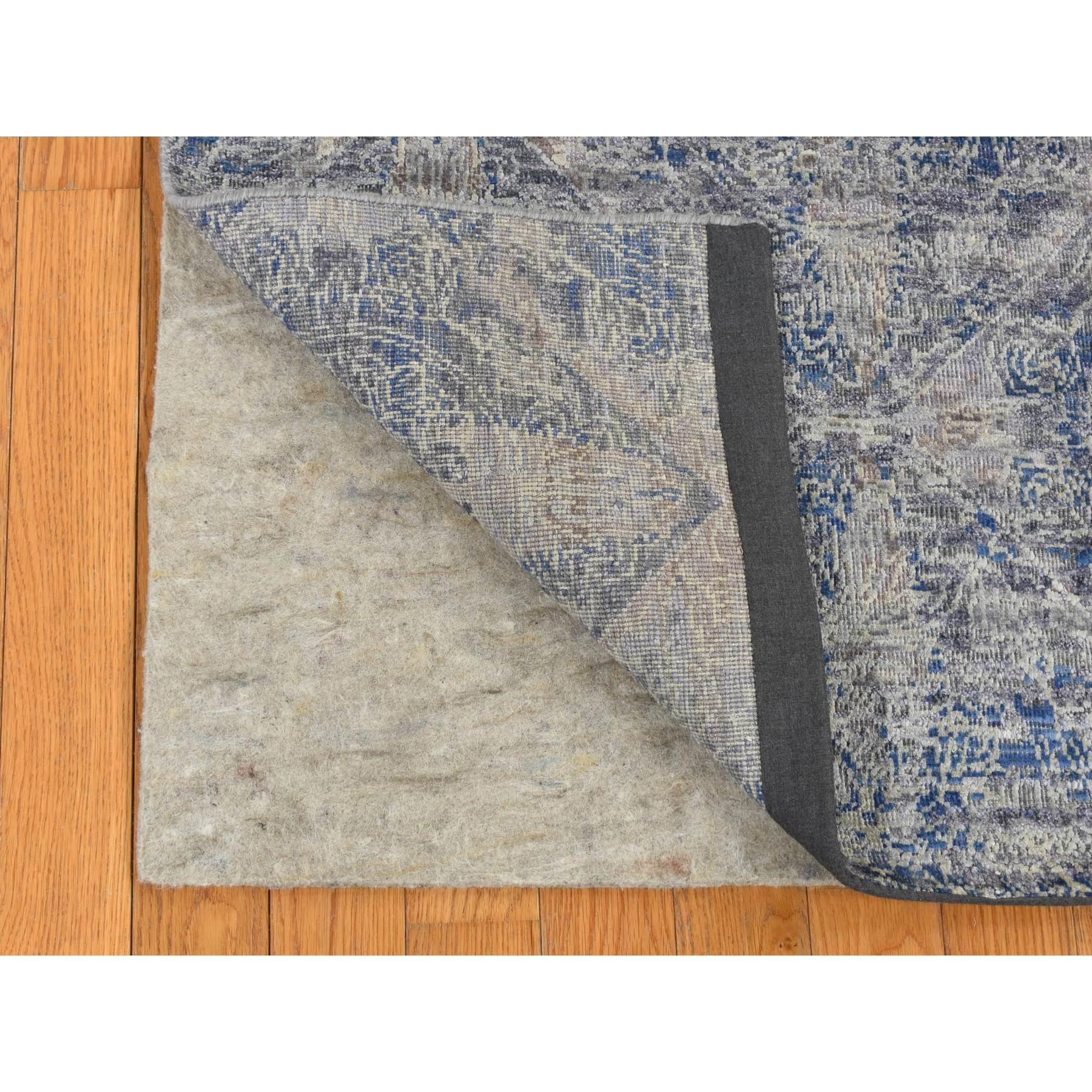 Medium Gray, ERASED ROSSETS, Silk with Textured Wool, Hand Knotted, Oriental Rug
Primary materials: Wool & Silk
Latex: No Pile 
height: 0.25 Inches
Style: Transitional
Primary color: Grey
Secondary colors: Blue, Black
Pattern: Oriental