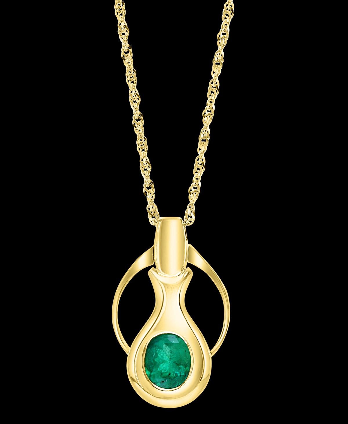 Approximately 4Ct Colombian Emerald  Pendent/Necklace 18 Karat Gold Estate Convertible to Ring Emerald and diamond Pendant  necklace. This eye-catching pendant necklace features a  4  ct total weight of Oval Colombian Emerald, all set in 18k  Yellow