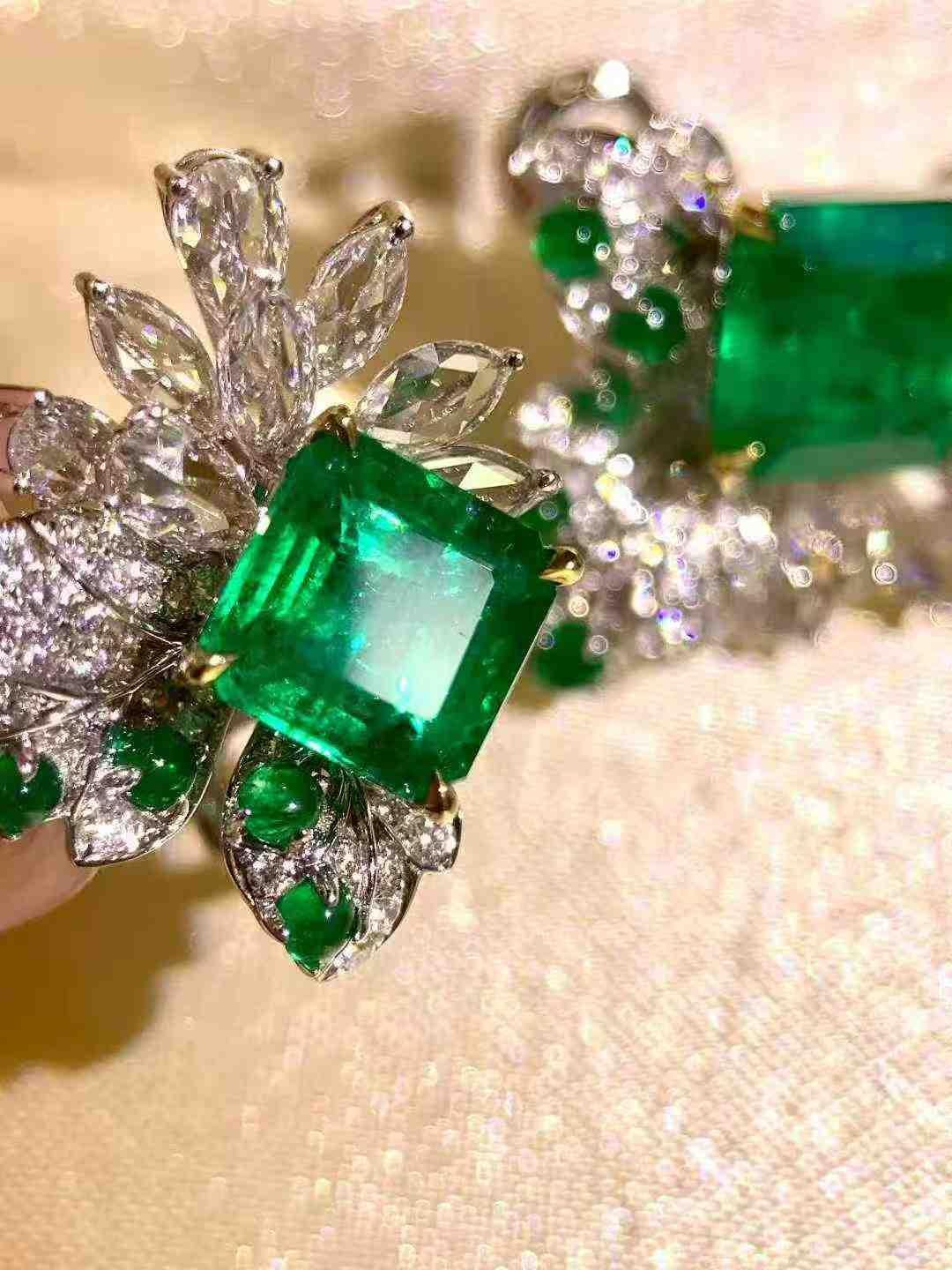 These luxurious 4ct emerald stud earrings are set in a sophisticated 18K white gold setting and adorned with 1.80ct of sparkling white diamonds. The rich green hue of the emeralds is beautifully complemented by the radiant diamonds, creating a
