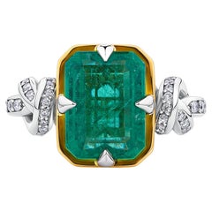 4ct Emerald Cut Forget Me Knot Emerald ring in Platinum and 22k Yellow Gold