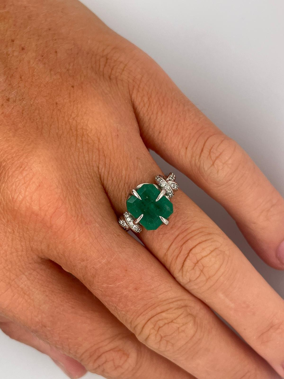 For Sale:  4ct Emerald solitaire in platinum with diamond knots  11