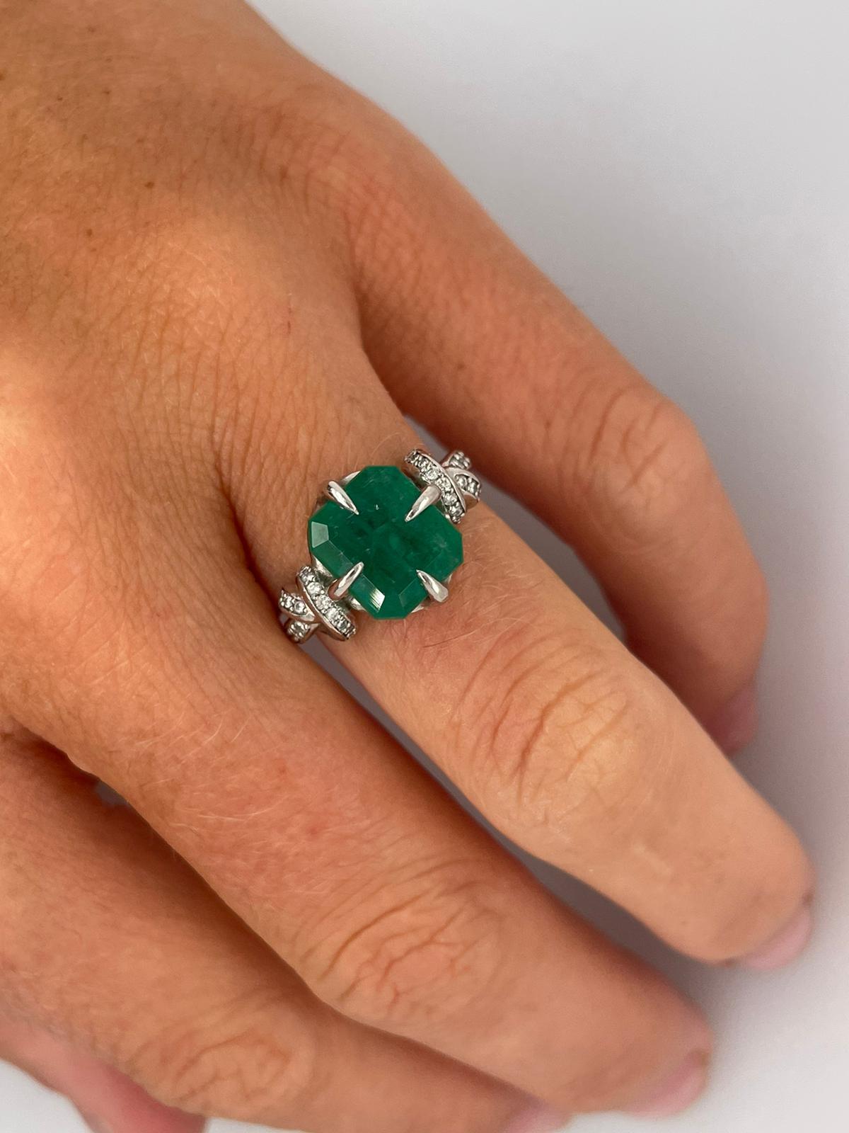 For Sale:  4ct Emerald solitaire in platinum with diamond knots  4